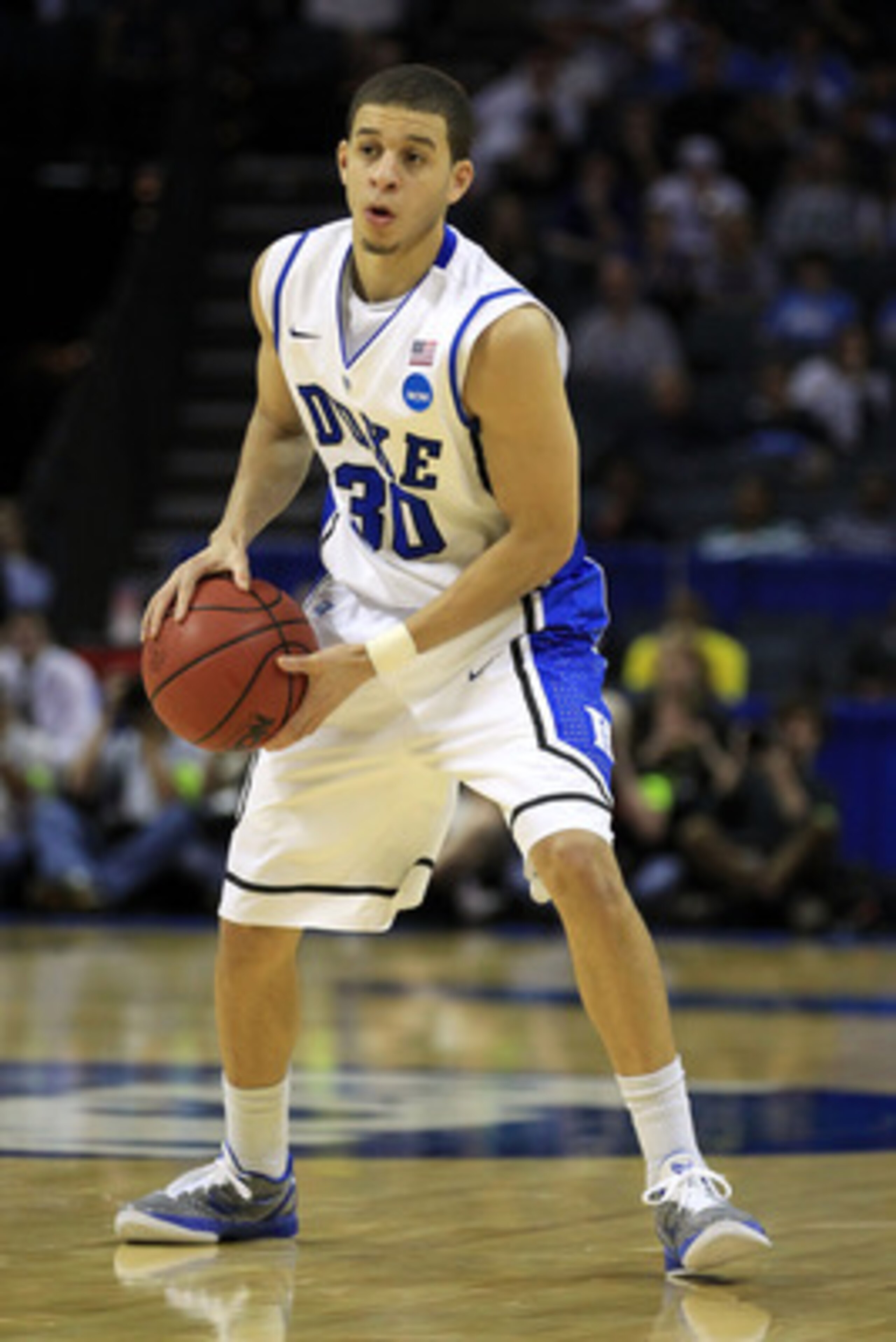 CHARLOTTE, NC - MARCH 20:  Seth Curry #30 of the Duke Blue Devils moves the ball while taking on the Michigan Wolverines during the third round of the 2011 NCAA men's basketball tournament at Time Warner Cable Arena on March 20, 2011 in Charlotte, North C