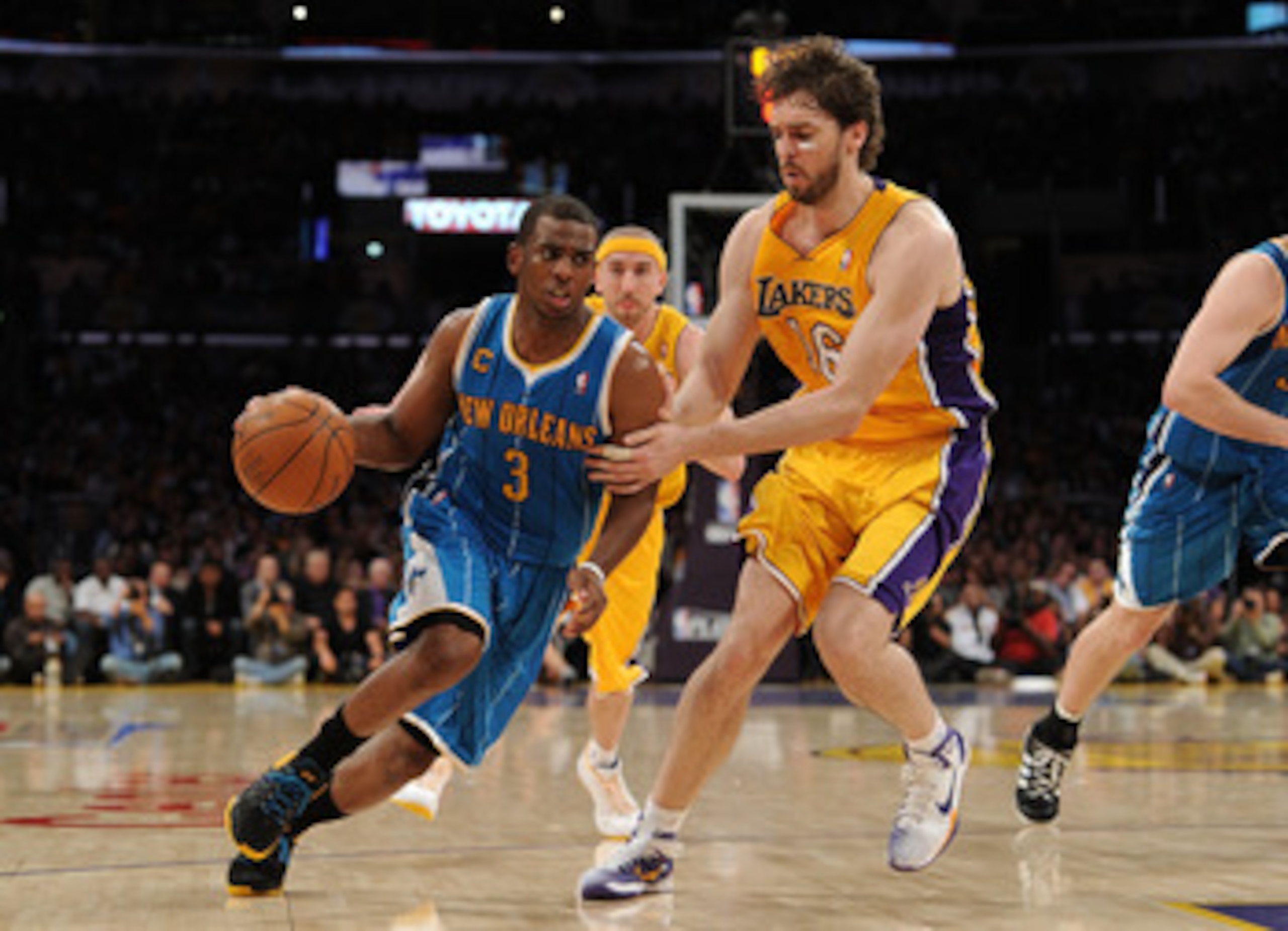 LOS ANGELES, CA - APRIL 20:  Chris Paul #3 of the New Orleans Hornets drives on Pau Gasol #16 of the Los Angeles Lakers in Game Two of the Western Conference Quarterfinals in the 2011 NBA Playoffs on April 20, 2011 at Staples Center in Los Angeles, Califo