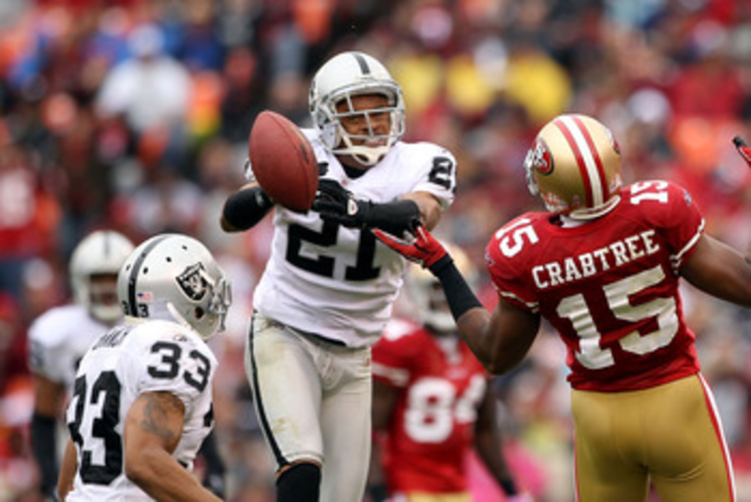 SAN FRANCISCO - OCTOBER 17:  Nnamdi Asomugha  #21 of the Oakland Raiders breaks up a pass intended for Michael Crabtree #15 of the San Francisco 49ers at Candlestick Park on October 17, 2010 in San Francisco, California.  (Photo by Ezra Shaw/Getty Images)