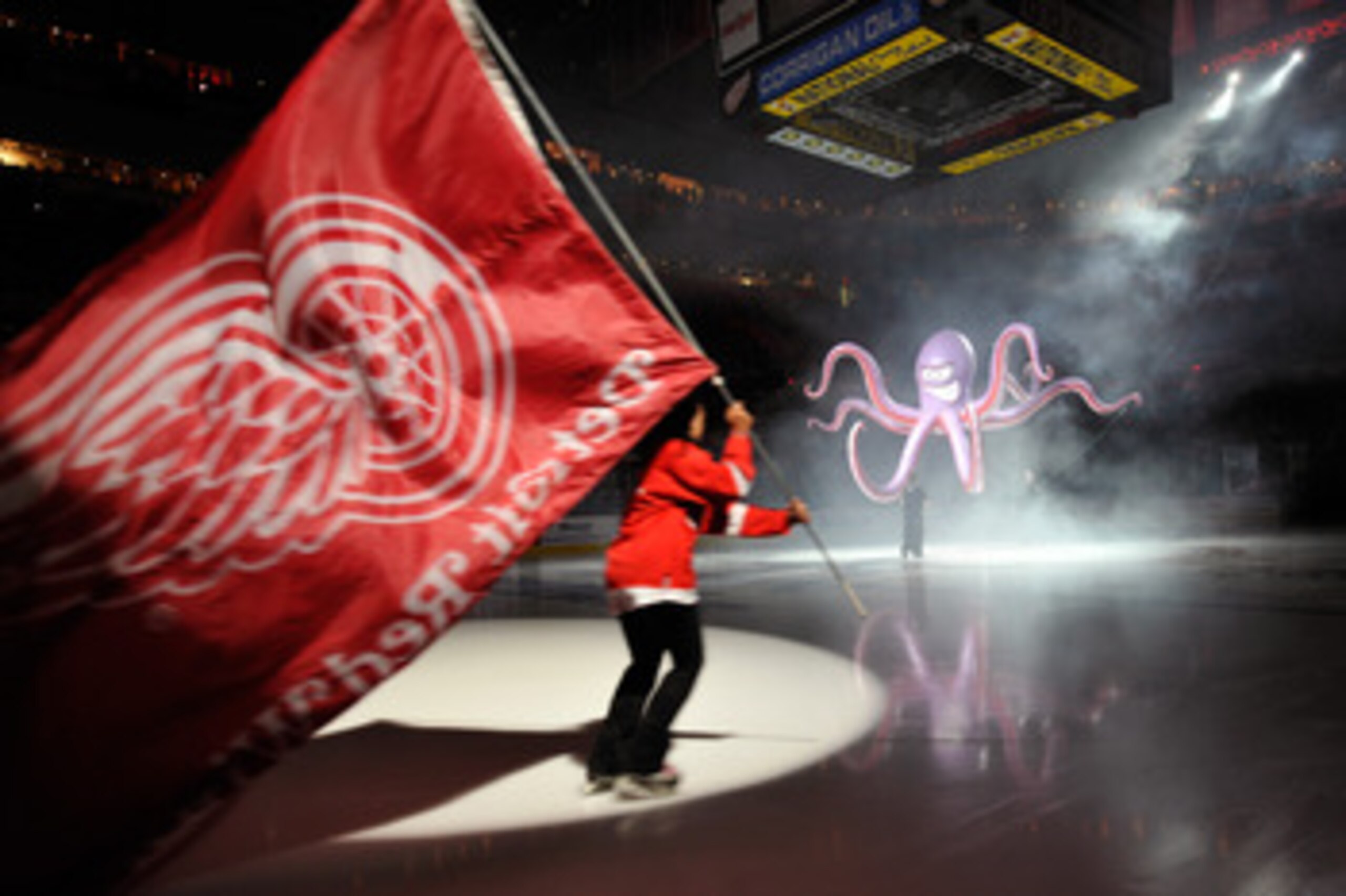DETROIT - MAY 4:  Pregame ceremonies before Game Three of the Western Conference Semifinals between the San Jose Sharks and the Detroit Red Wings included an octopus dropping from the scoreboard and skaters with flags during the 2011 NHL Stanley Cup Playo