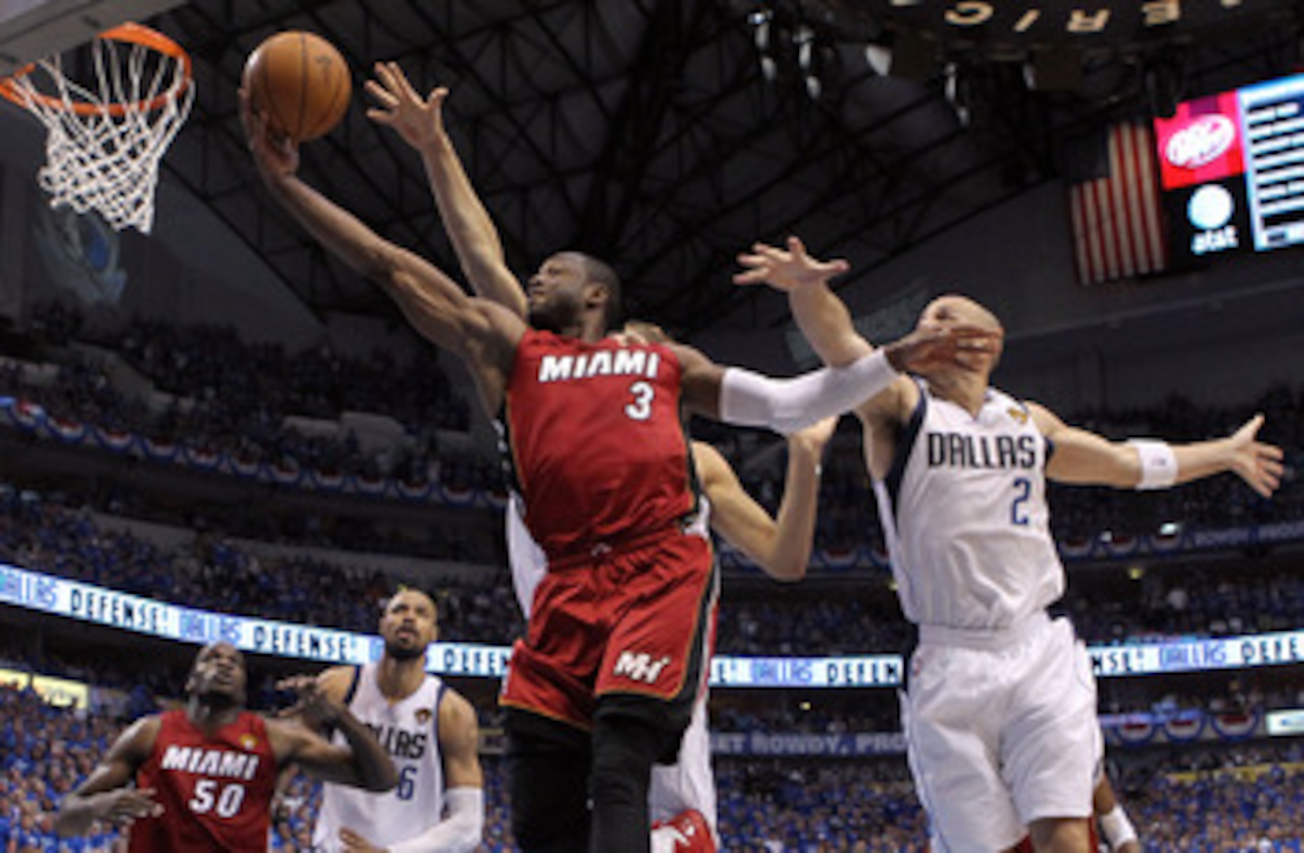DALLAS, TX - JUNE 05:  Dwyane Wade #3 of the Miami Heat goes up for a shot between Dirk Nowitzki #41 and Jason Kidd #2 of the Dallas Mavericks in the third quarter in Game Three of the 2011 NBA Finals at American Airlines Center on June 5, 2011 in Dallas,