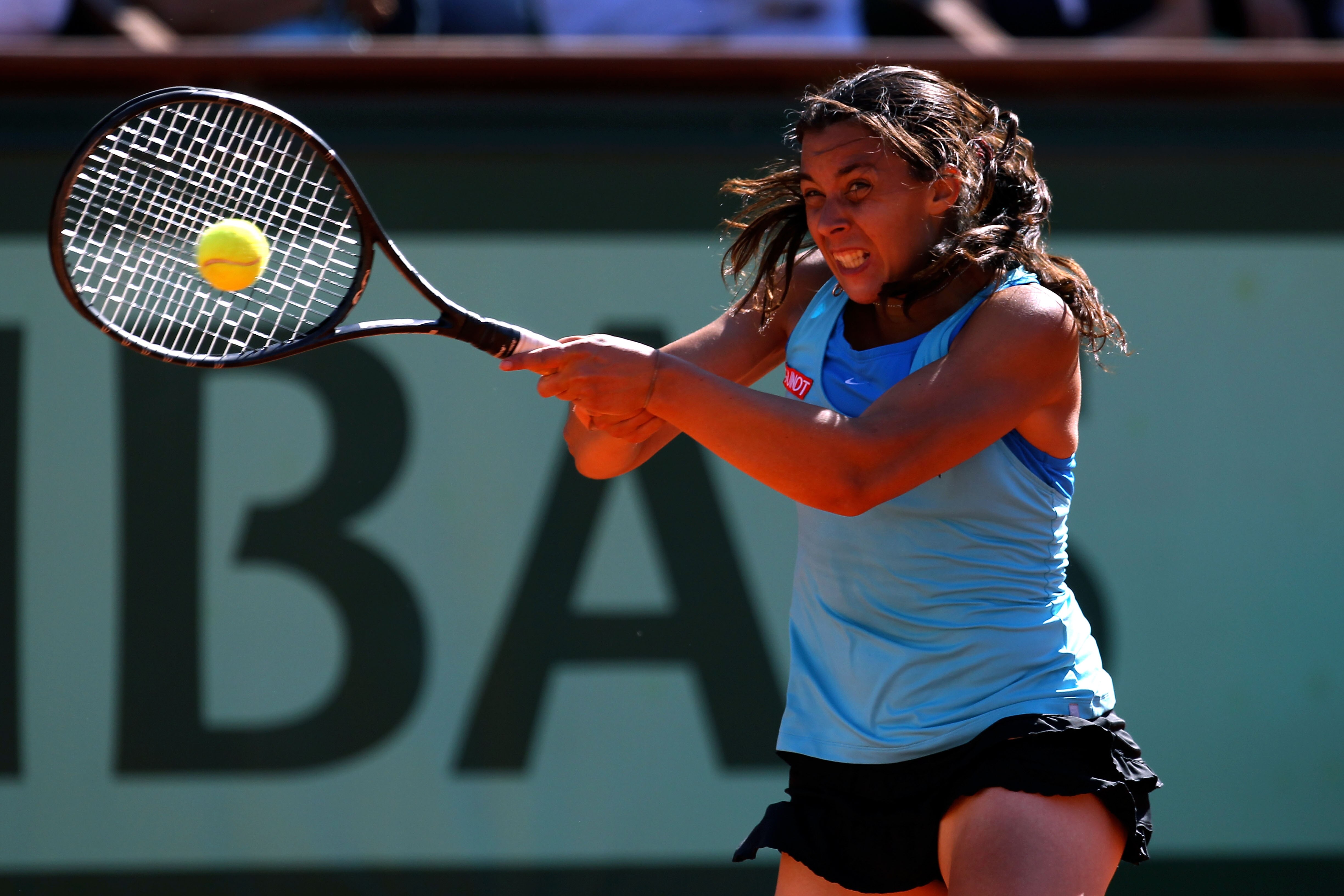 PARIS, FRANCE - JUNE 02:  Marion Bartoli of France hits a forehand during the women's singles semi final match between Marion Bartoli of France and Francesca Schiavone of Italy on day twelve of the French Open at Roland Garros on June 2, 2011 in Paris, Fr