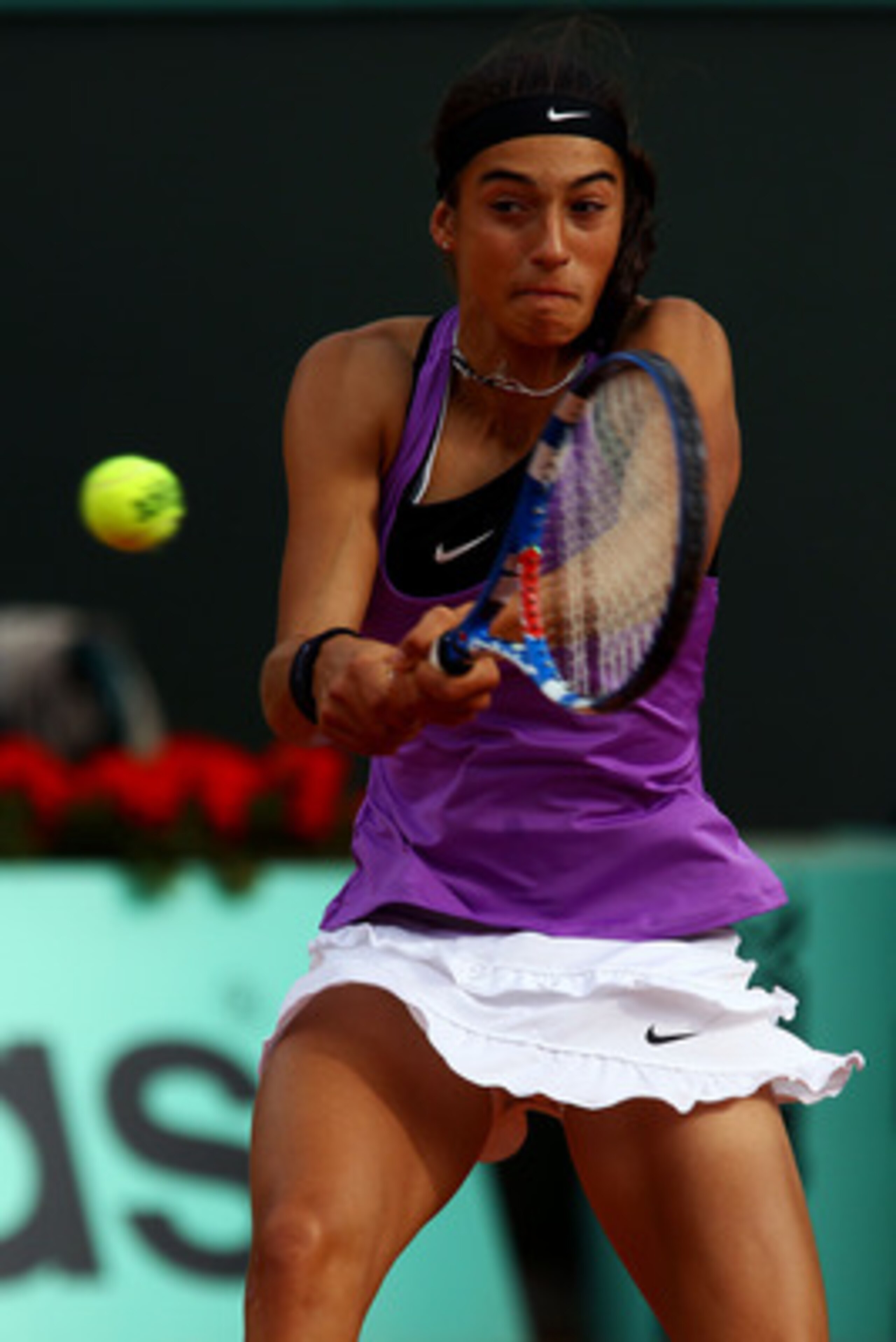 PARIS, FRANCE - MAY 26:  Caroline Garcia of France hits a backhand during the women's singles round two match between Maria Sharapova of Russia and Caroline Garcia of France on day five of the French Open at Roland Garros on May 26, 2011 in Paris, France.