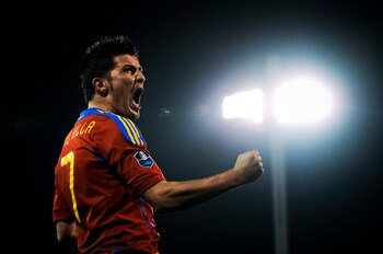 GRANADA, SPAIN - MARCH 25:  David Villa of Spain (R) celebrates after scoring his second goal during the UEFA EURO 2012 qualifier between Spain and Czech Republic at Los Carmenes Stadium on March 25, 2011 in Granada, Spain.  Spain win 2-1. (Photo by David