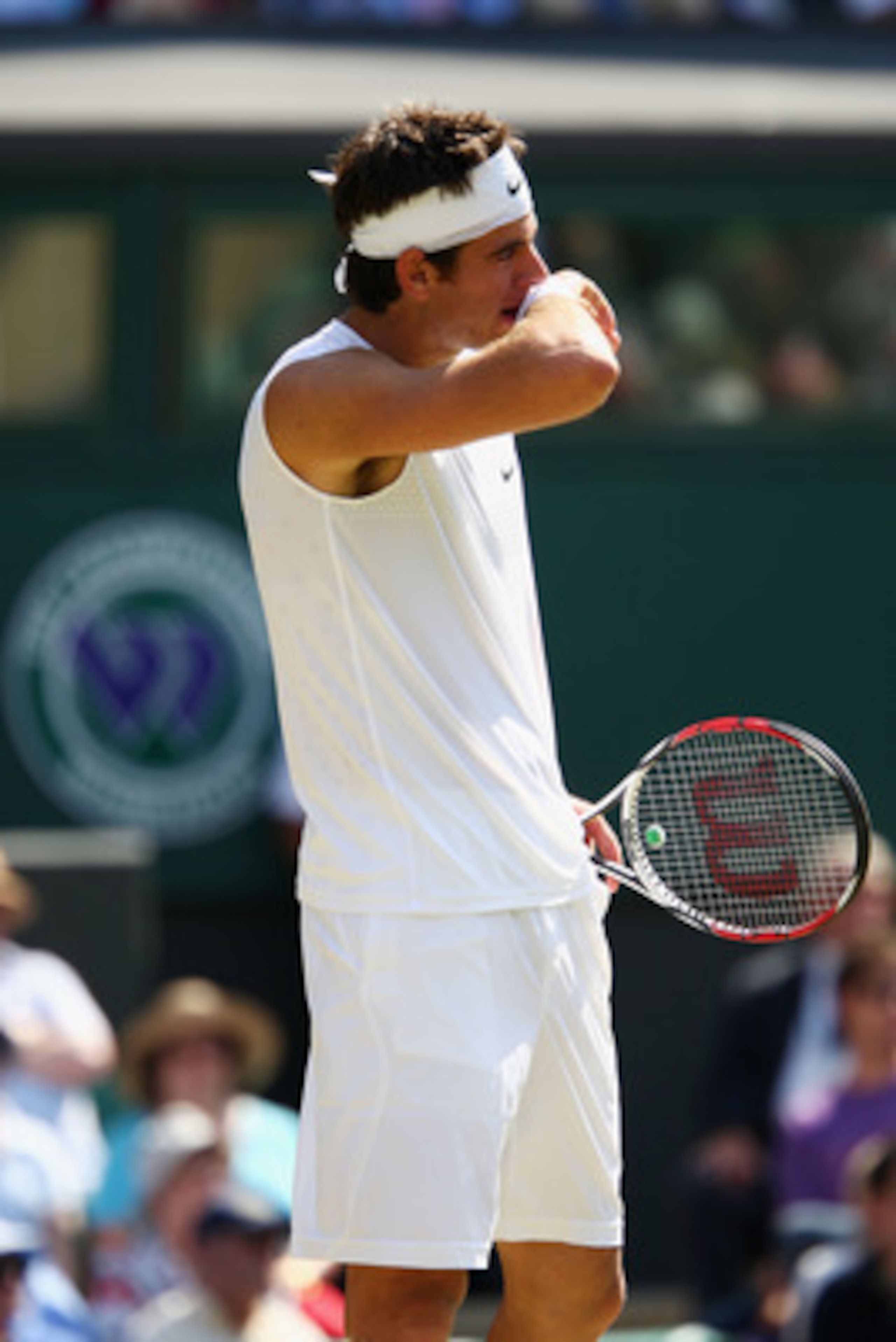 WIMBLEDON, ENGLAND - JUNE 25:  Juan Martin Del Potro of Argentina looks despondent during the men's singles second round match against Lleyton Hewitt of Australia on Day Four of the Wimbledon Lawn Tennis Championships at the All England Lawn Tennis and Cr