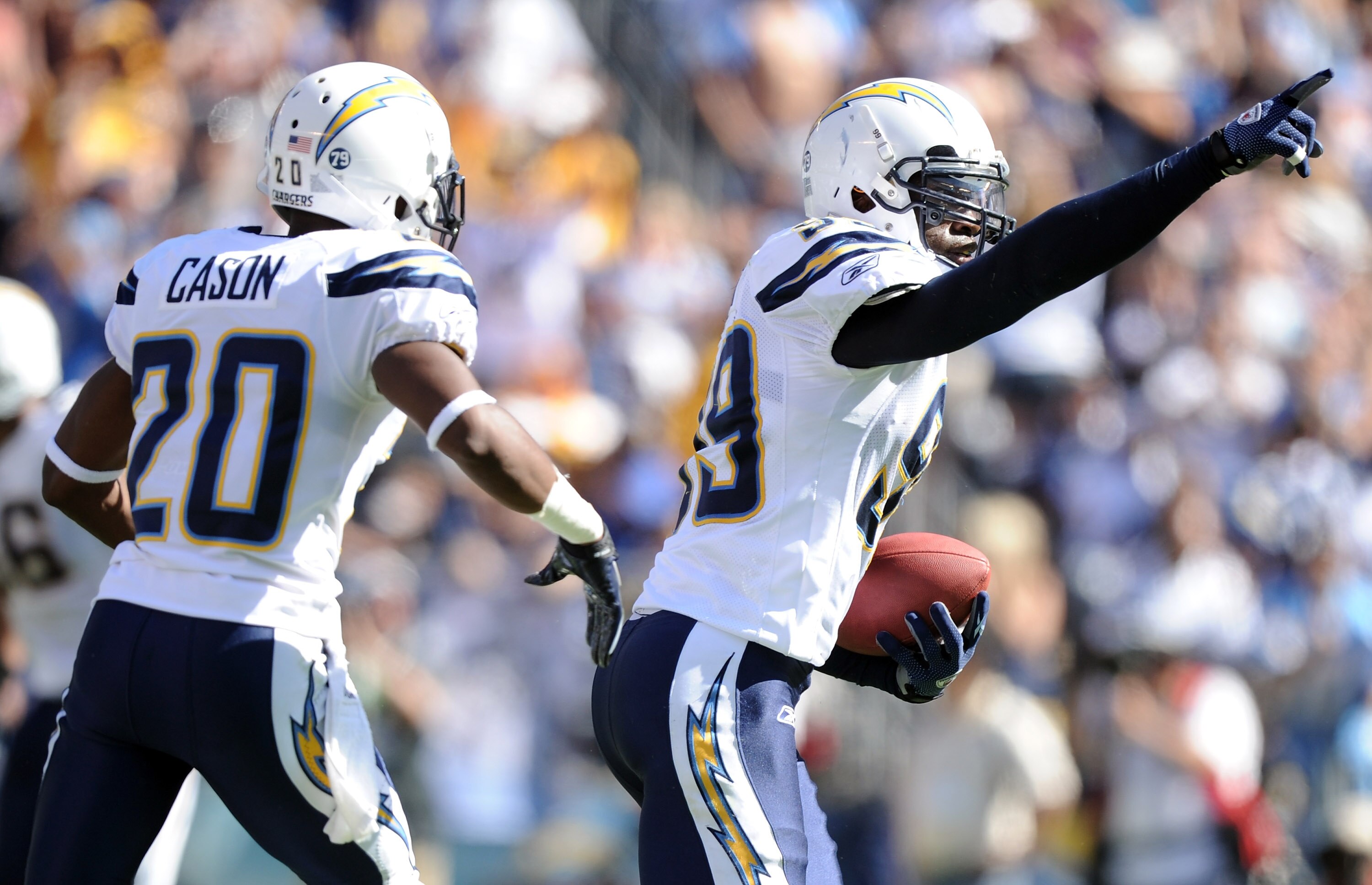 SAN DIEGO - SEPTEMBER 19:  Brandon Siler #59 of the San Diego Chargers celebrates his interception in front of Antoine Cason #20 against the Jacksonville Jaguars during the third quarter at Qualcomm Stadium on September 19, 2010 in San Diego, California.