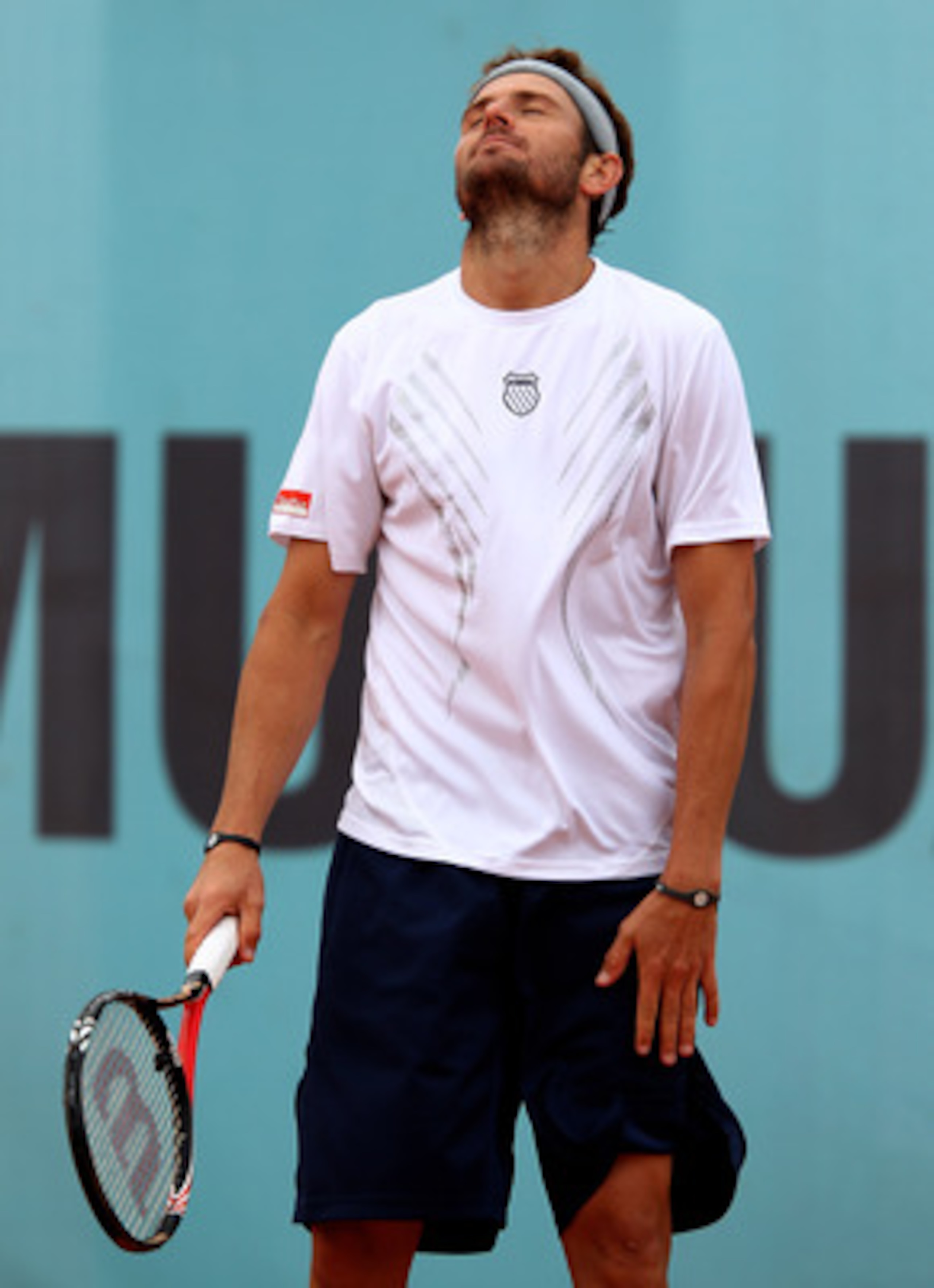 MADRID, SPAIN - MAY 12:  Mardy Fish of the USA  shows his dejection against Jurgen Melzer of Austria in their second round match during the Mutua Madrilena Madrid Open tennis tournament at the Caja Magica on May 12, 2010 in Madrid, Spain.  (Photo by Clive