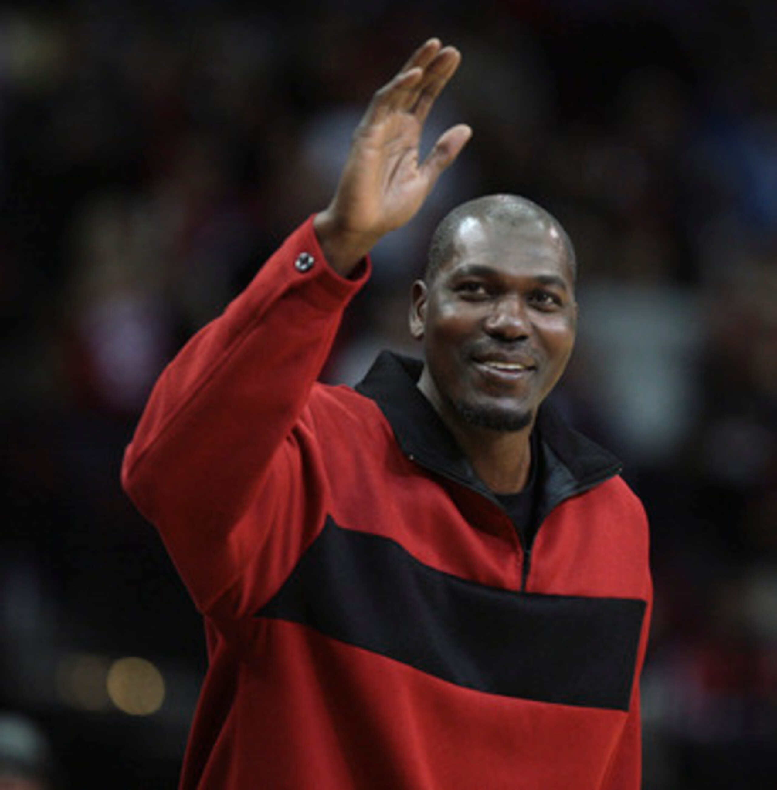 HOUSTON - DECEMBER 29:  Former Houston Rockets Hakeem Olajuwon waves to the crowd as he is introduced to the crowd at Toyota Center on December 29, 2010 in Houston, Texas.  NOTE TO USER: User expressly acknowledges and agrees that, by downloading and or u