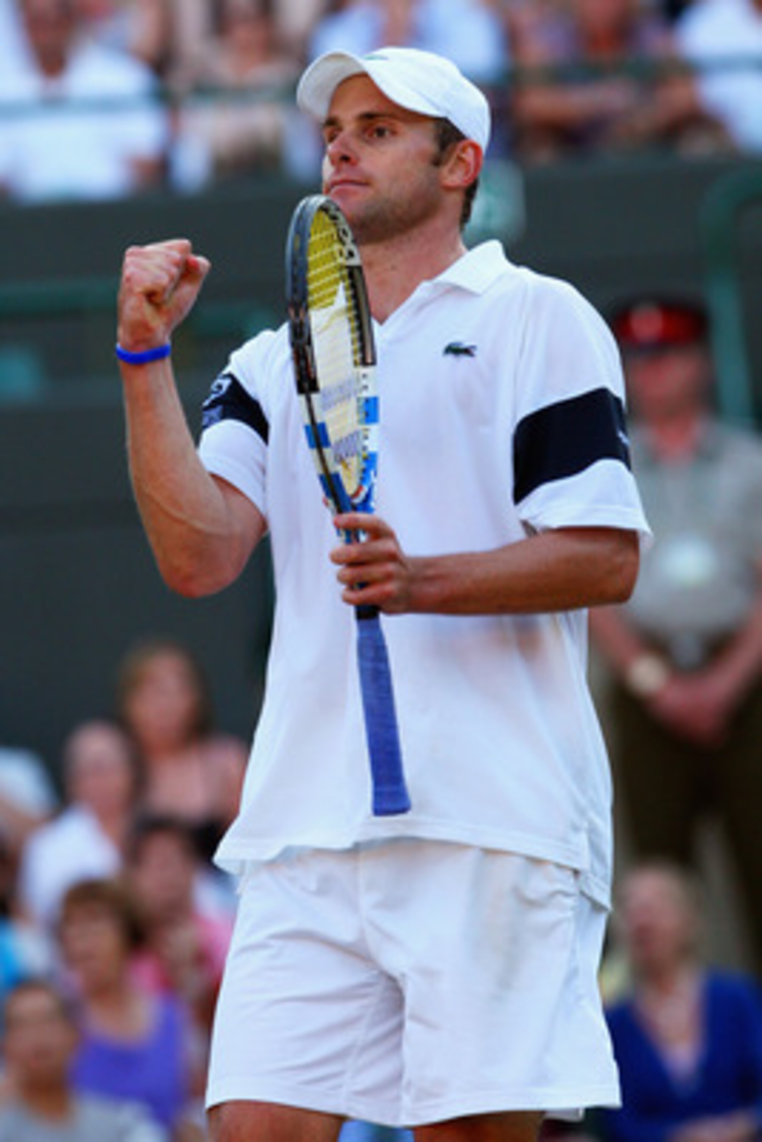 WIMBLEDON, ENGLAND - JULY 01:  Andy Roddick of USA celebrates victory during the men's singles quarter final match against Lleyton Hewitt of Australia on Day Nine of the Wimbledon Lawn Tennis Championships at the All England Lawn Tennis and Croquet Club o
