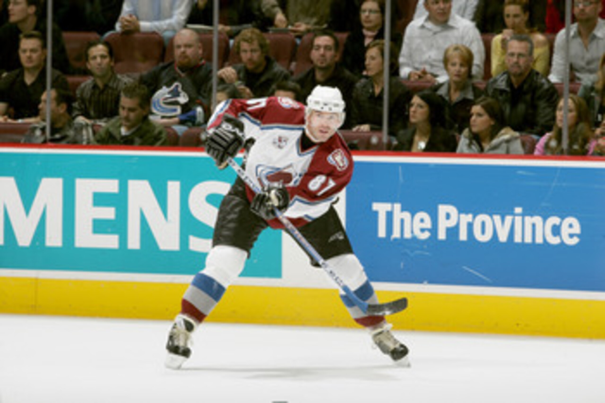 VANCOUVER - OCTOBER 22:  Center Pierre Turgeon #87 of the Colorado Avalanche passes the puck during the game against the Vancouver Canucks at General Motors Place on October 22, 2005 in Vancouver, Canada. The Canucks won 6-4. (Photo by Jeff Vinnick/Getty 