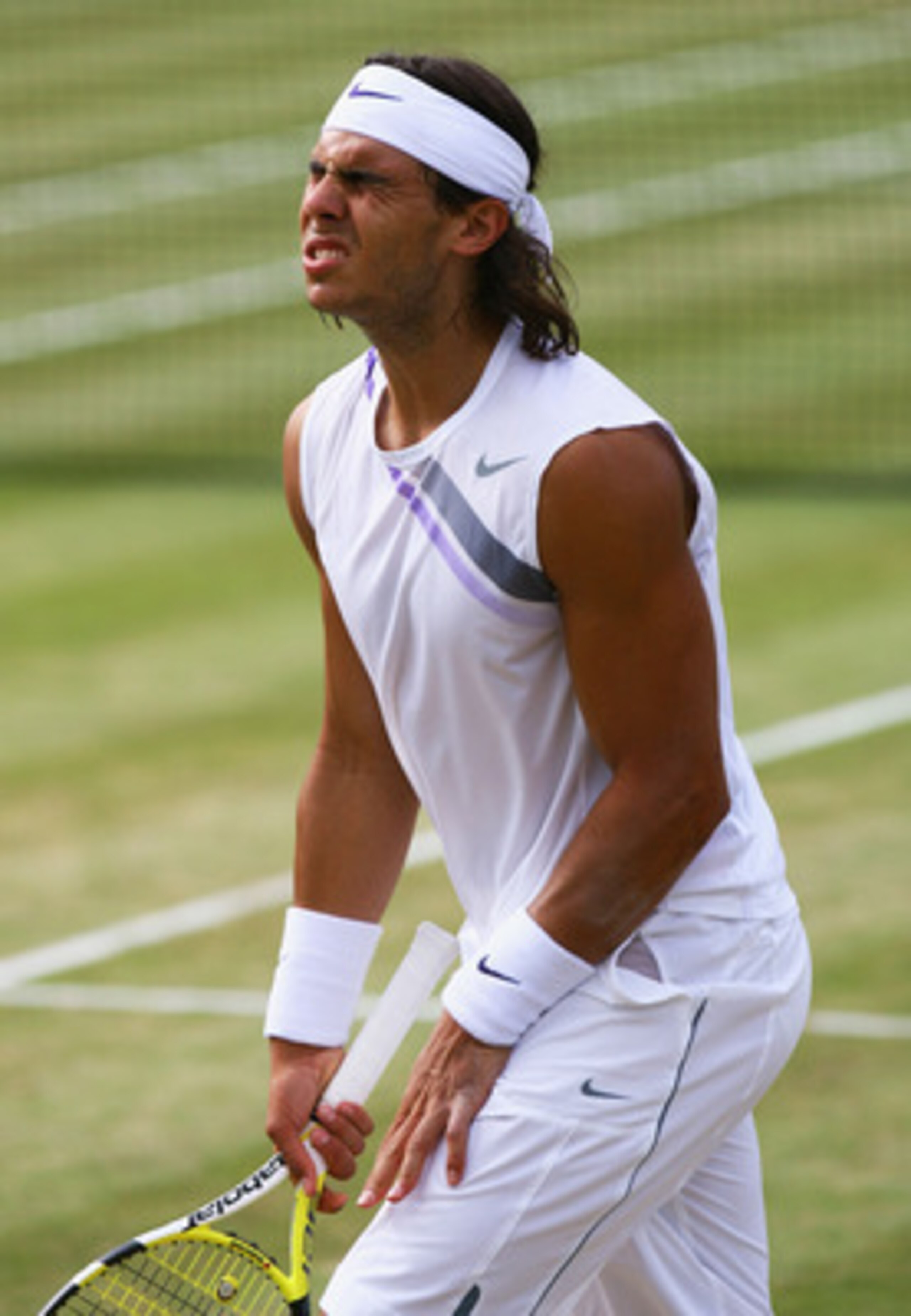 LONDON - JULY 08:  Rafael Nadal of Spain reacts during the Men's Singles final match against Roger Federer of Switzerland during day thirteen of the Wimbledon Lawn Tennis Championships at the All England Lawn Tennis and Croquet Club on July 8, 2007 in Lon