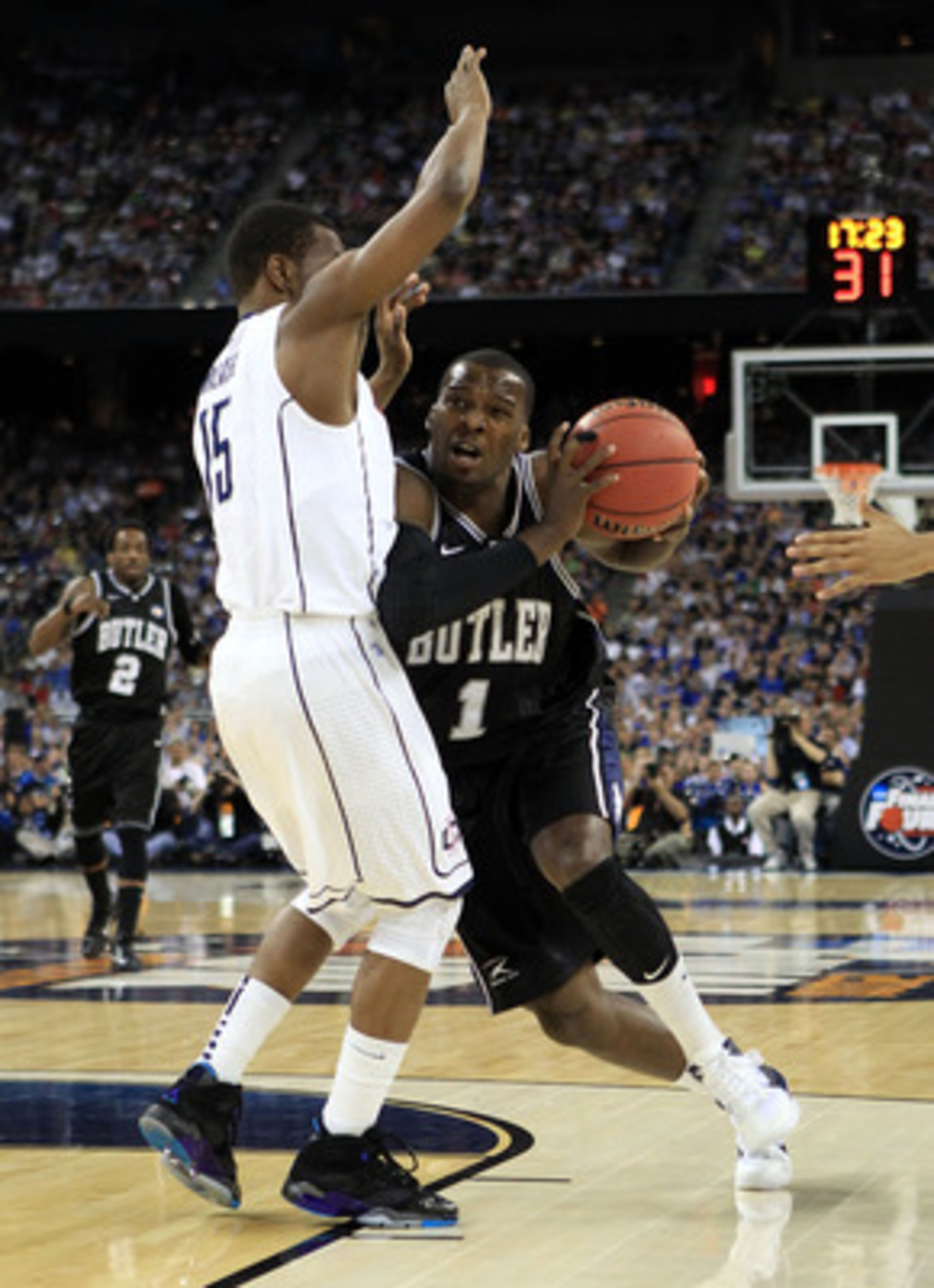 HOUSTON, TX - APRIL 04: Shelvin Mack #1 of the Butler Bulldogs drives on Kemba Walker #15 of the Connecticut Huskies during the National Championship Game of the 2011 NCAA Division I Men's Basketball Tournament at Reliant Stadium on April 4, 2011 in Hous HOUSTON, TX - APRIL 04: Shelvin Mack #1 of the Butler Bulldogs drives on Kemba Walker #15 of the Connecticut Huskies during the National Championship Game of the 2011 NCAA Division I Men's Basketball Tournament at Reliant Stadium on April 4, 2011 in Hous