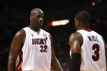 MIAMI - NOVEMBER 27: Shaquille O'Neal #32 and Dwyane Wade #3 of the Miami Heat talk between plays while taking on the Charlotte Bobcats at American Airlines Arena November 27, 2007 in Miami, Florida. NOTE TO USER: User expressly acknowledges and agrees t MIAMI - NOVEMBER 27: Shaquille O'Neal #32 and Dwyane Wade #3 of the Miami Heat talk between plays while taking on the Charlotte Bobcats at American Airlines Arena November 27, 2007 in Miami, Florida. NOTE TO USER: User expressly acknowledges and agrees t
