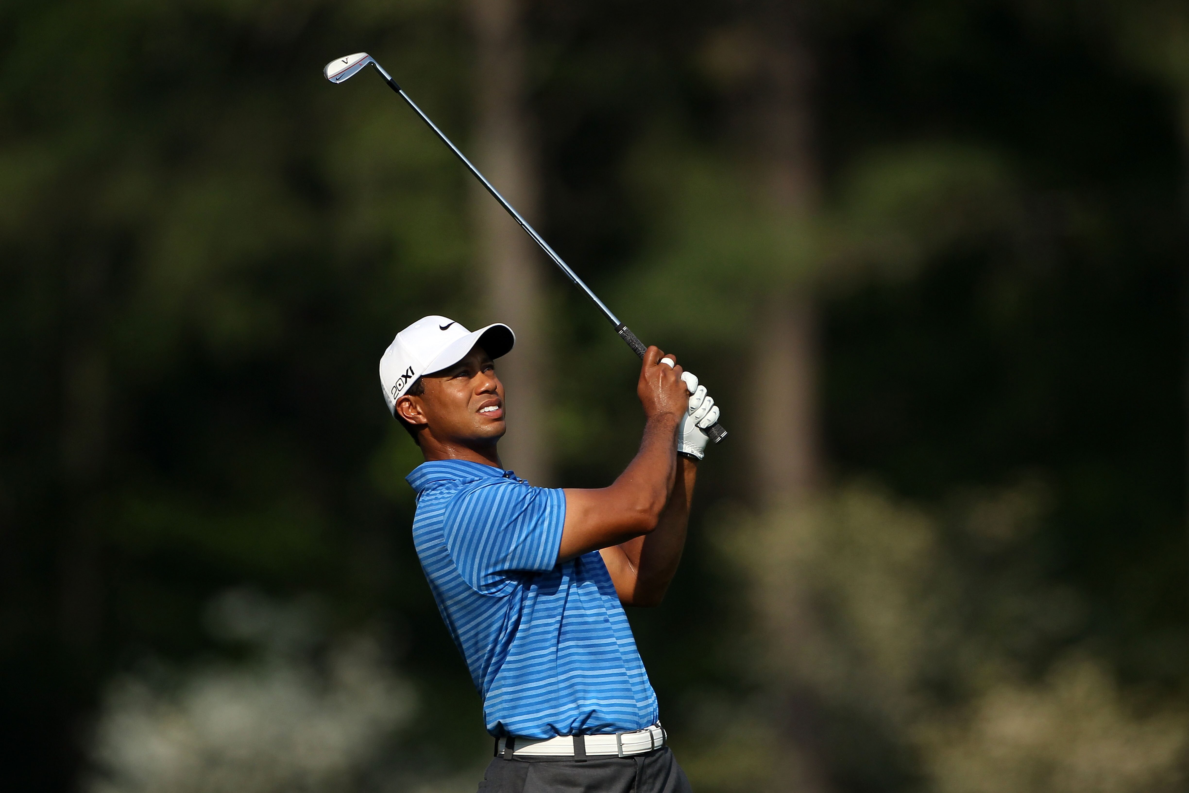 AUGUSTA, GA - APRIL 09:  Tiger Woods hits a shot on the 12th hole during the third round of the 2011 Masters Tournament at Augusta National Golf Club on April 9, 2011 in Augusta, Georgia.  (Photo by Andrew Redington/Getty Images)