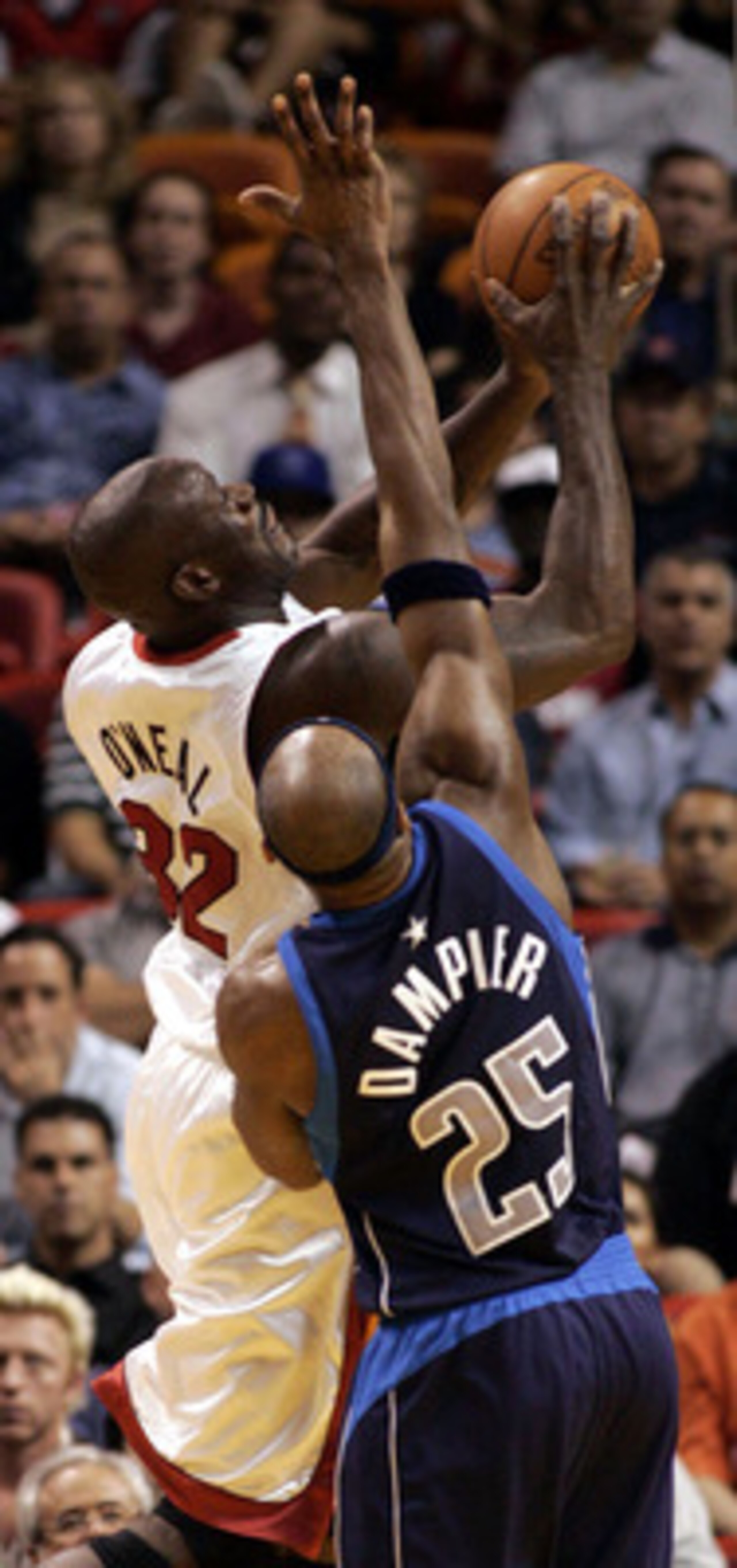 MIAMI - NOVEMBER 11:  Shaquille O'Neal #32 of the Miami Heat shoots over Erick Dampier #35 of the Dallas Mavericks on November 11, 2004 at the American Airlines Arena in Miami, Florida. NOTE TO USER: User Expressly acknowledges and agrees that, by downloa