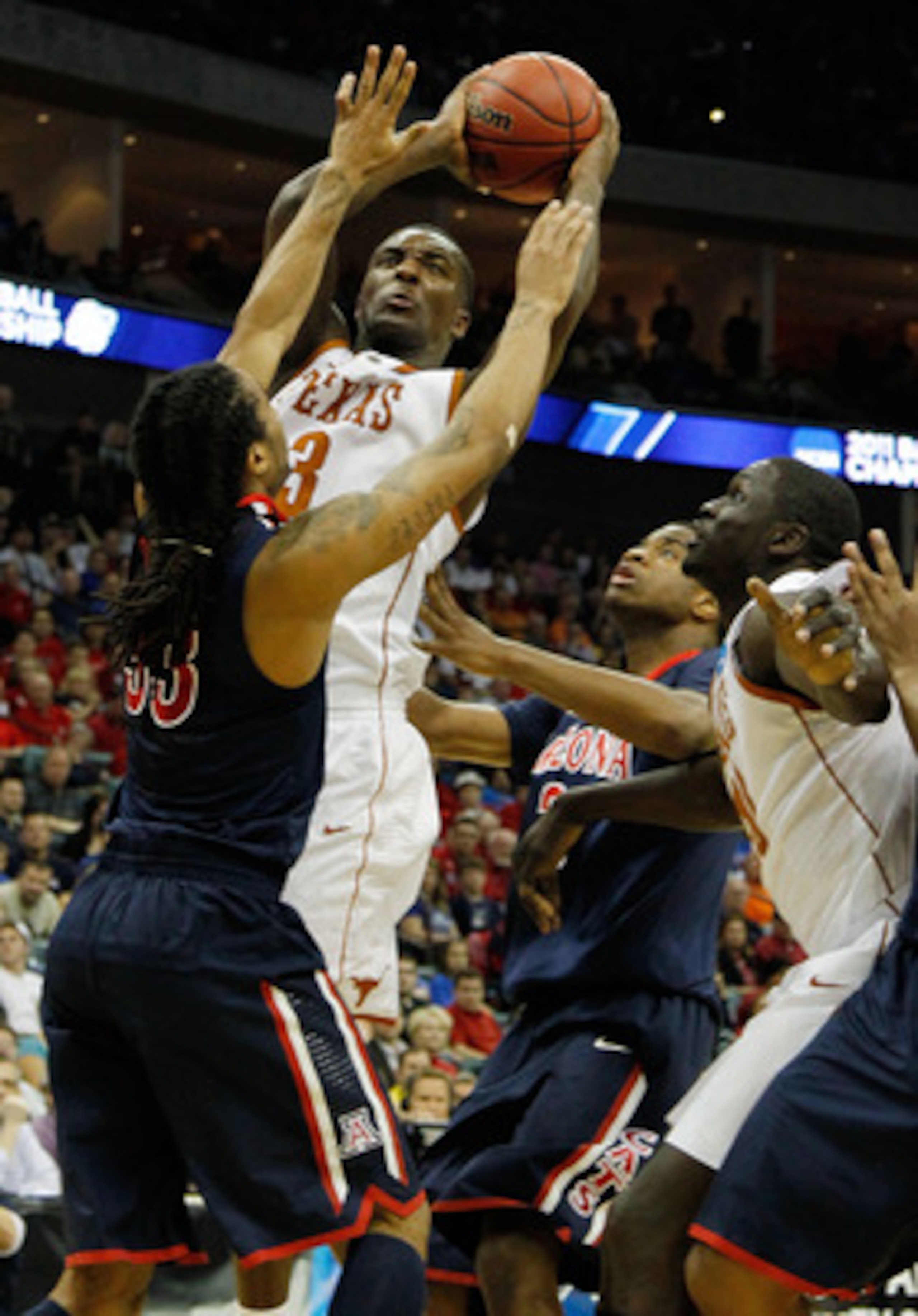 TULSA, OK - MARCH 20: Jordan Hamilton #3 of the Texas Longhorns goes up for a shot against Jesse Perry #33 of the Arizona Wildcats during the third round of the 2011 NCAA men's basketball tournament at BOK Center on March 20, 2011 in Tulsa, Oklahoma. (P TULSA, OK - MARCH 20: Jordan Hamilton #3 of the Texas Longhorns goes up for a shot against Jesse Perry #33 of the Arizona Wildcats during the third round of the 2011 NCAA men's basketball tournament at BOK Center on March 20, 2011 in Tulsa, Oklahoma. (P