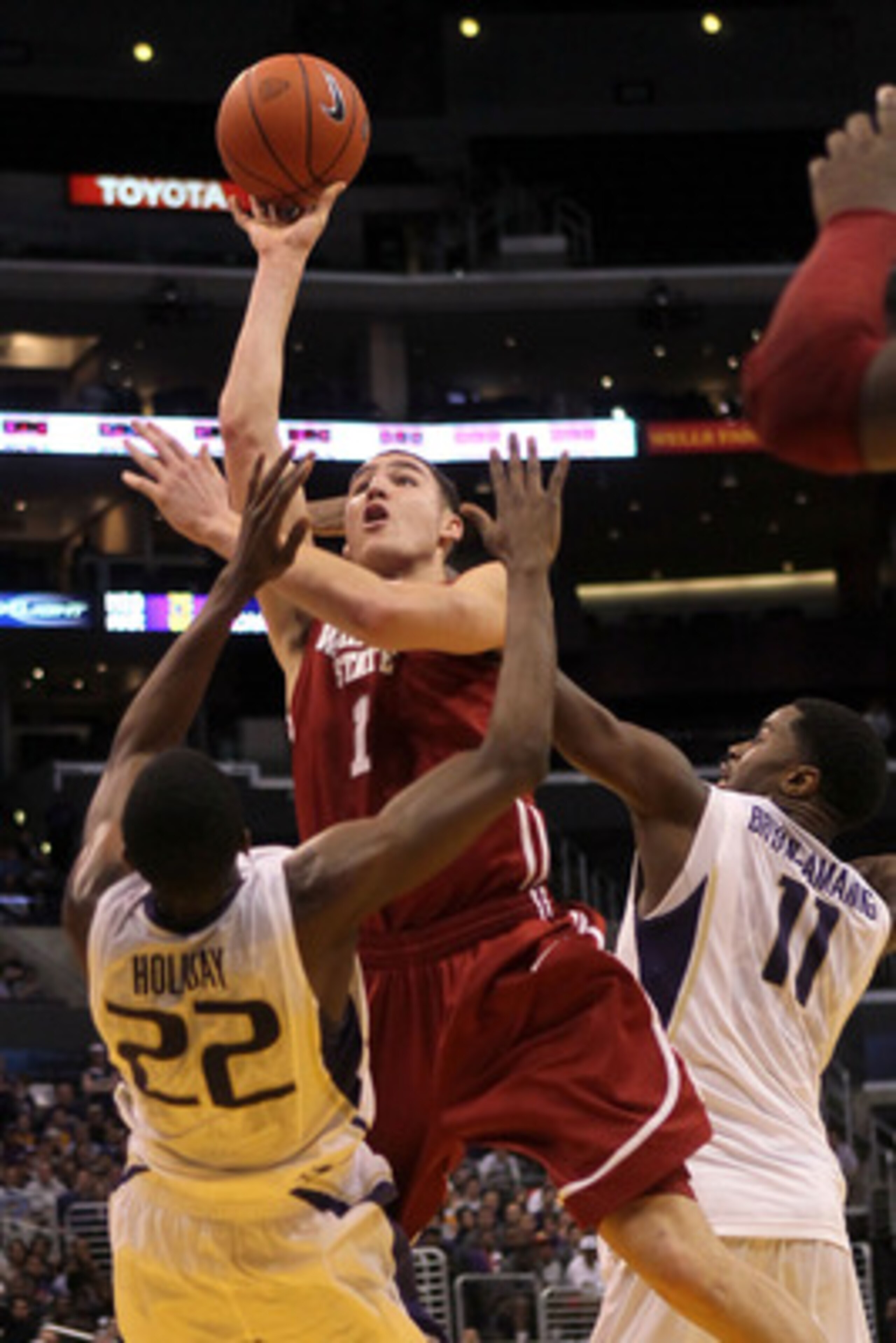 LOS ANGELES, CA - MARCH 10: Klay Thompson #1 of the Washington State Cougars shoots over Justin Holiday #22 and Matthew Bryan-Amaning #11 of the Washington Huskies in the second half in the quarterfinals of the 2011 Pacific Life Pac-10 Men's Basketball T LOS ANGELES, CA - MARCH 10: Klay Thompson #1 of the Washington State Cougars shoots over Justin Holiday #22 and Matthew Bryan-Amaning #11 of the Washington Huskies in the second half in the quarterfinals of the 2011 Pacific Life Pac-10 Men's Basketball T