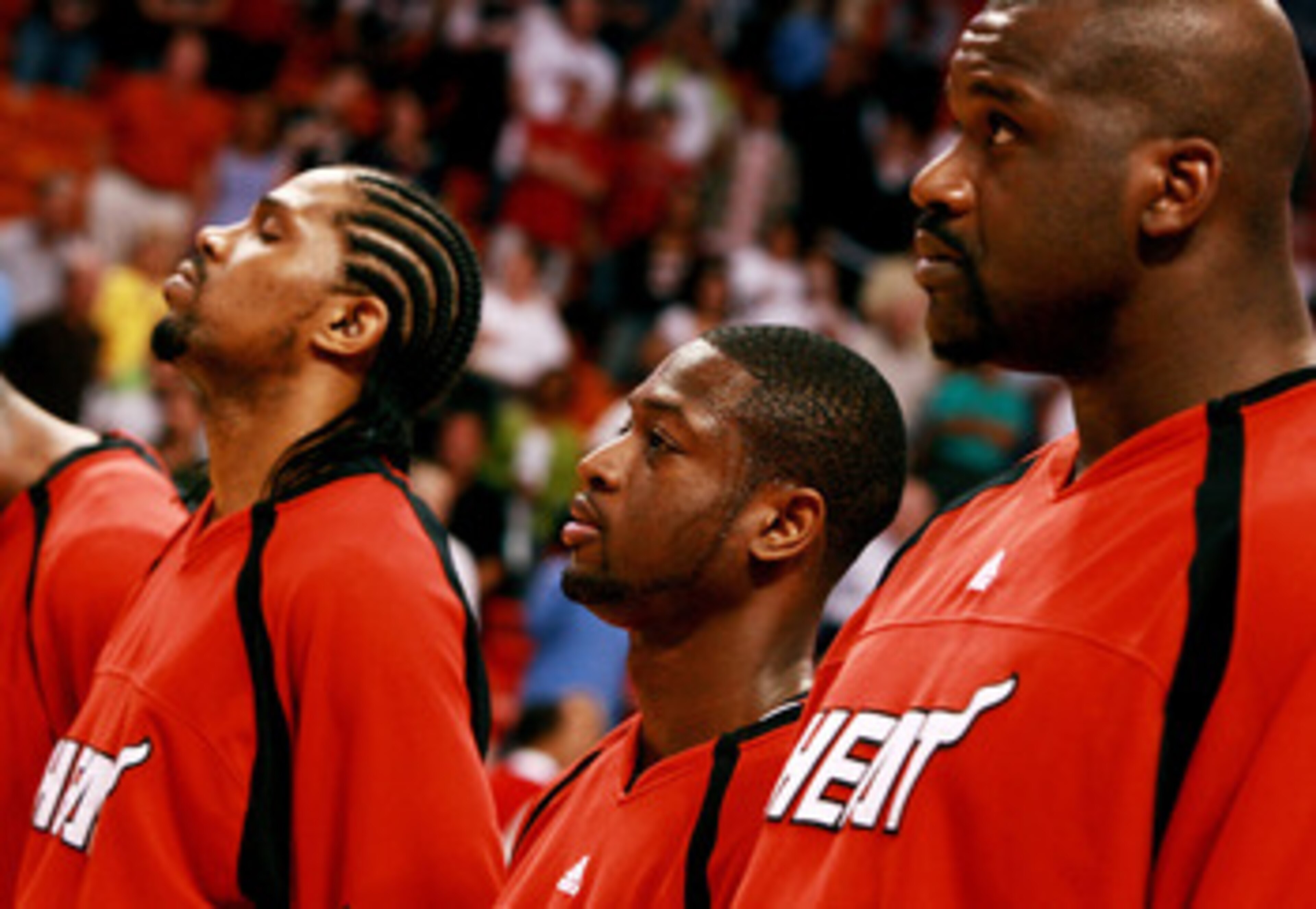 MIAMI - APRIL 8:  Dwyane Wade #3 of the Miami Heat lines up between Udonis Haslem #40 (L) and Shaquille O'Neal #32 during pre-game ceremonies prior to taking on the Charlotte Bobcats at American Airlines Arena April 8, 2007 in Miami, Florida. NOTE TO USER
