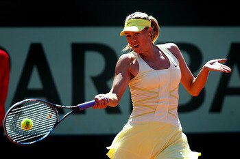 PARIS, FRANCE - JUNE 01:  Maria Sharapova of Russia hits a forehand during the women's singles quarterfinal match between Maria Sharapova of Russia and Andrea Petkovic of Germany on day eleven of the French Open at Roland Garros on June 1, 2011 in Paris,