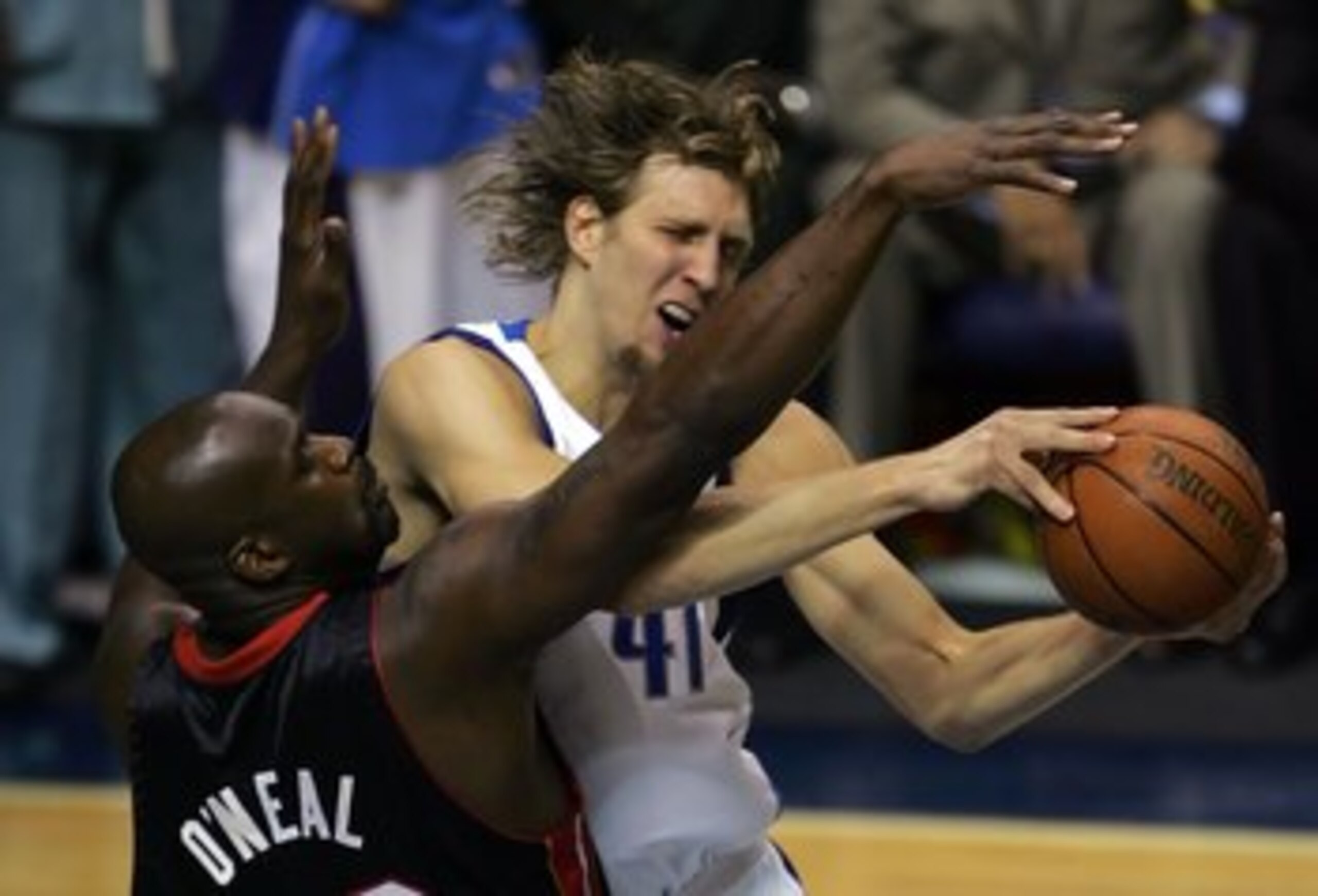 DALLAS - JUNE 11:  Dirk Nowitzki #41 of the Dallas Mavericks goes up for a shot over Shaquille O'Neal #32 of the Miami Heat in the first quarter in game two of the 2006 NBA Finals on June 11, 2006 at American Airlines Center in Dallas, Texas.  NOTE TO USE
