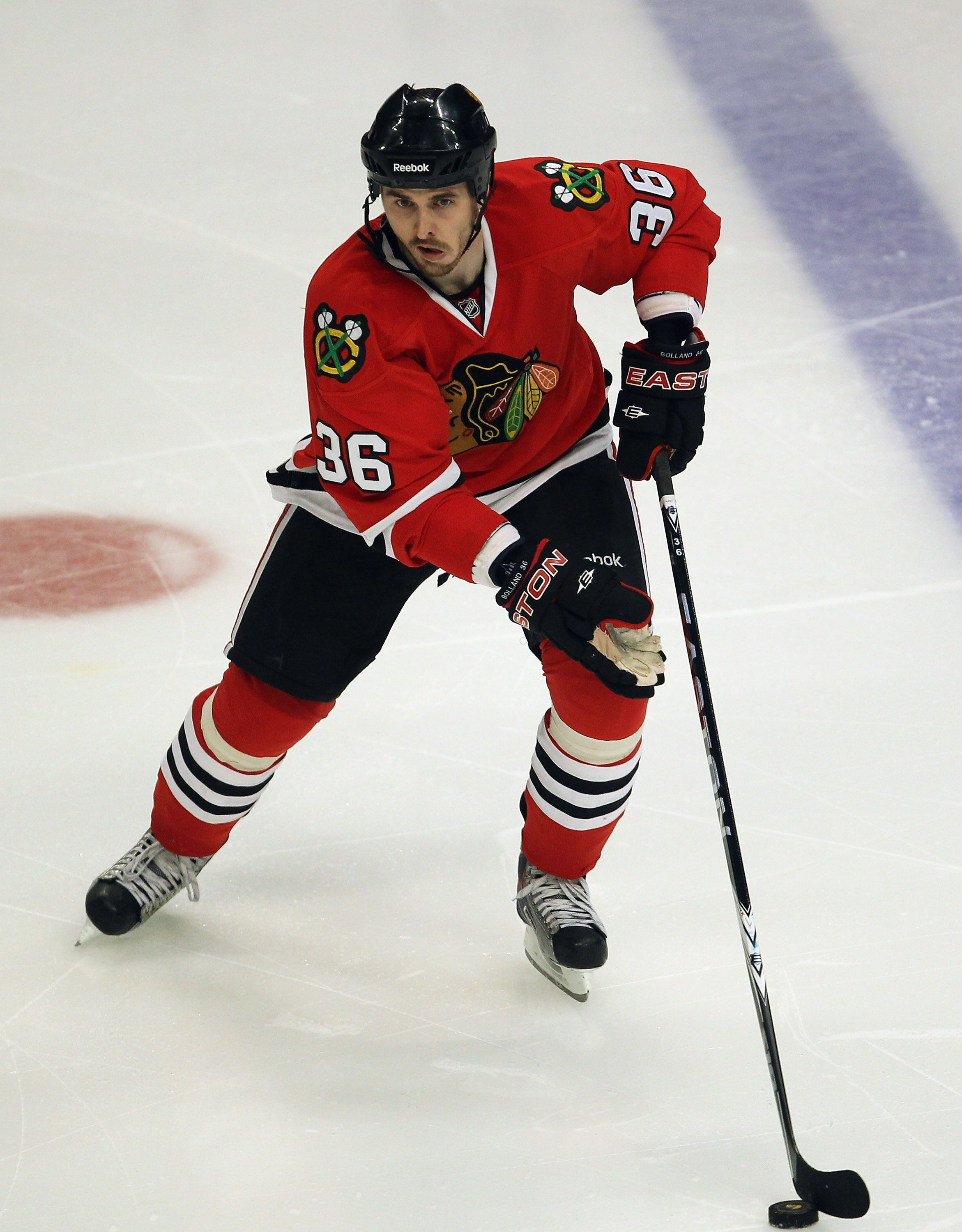 CHICAGO, IL - APRIL 24: Dave Bolland #36 of the Chicago Blackhawks controls the puck against the Vancouver Canucks in Game Six of the Western Conference Quarterfinals during the 2011 NHL Stanley Cup Playoffs at the United Center on April 24, 2011 in Chica