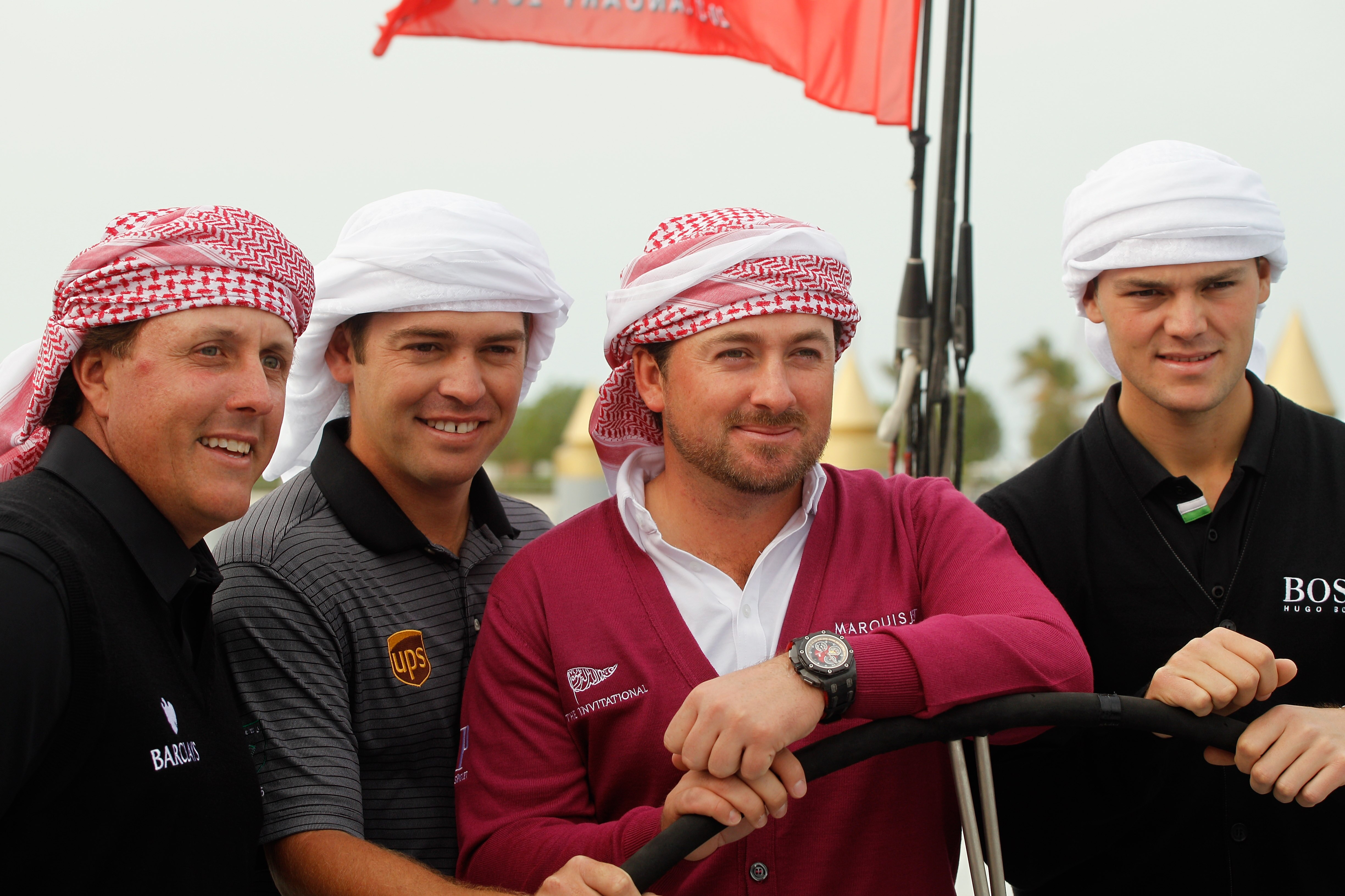 ABU DHABI, UNITED ARAB EMIRATES - JANUARY 18:  (L to R) 2010 Major Champions, Phil Mickelson of the USA, Louis Oosthuizen of South Africa, Graeme McDowell of Northern Ireland and Martin Kaymer of Germany pose on the Abu Dhabi Ocean Racing entry for the 20