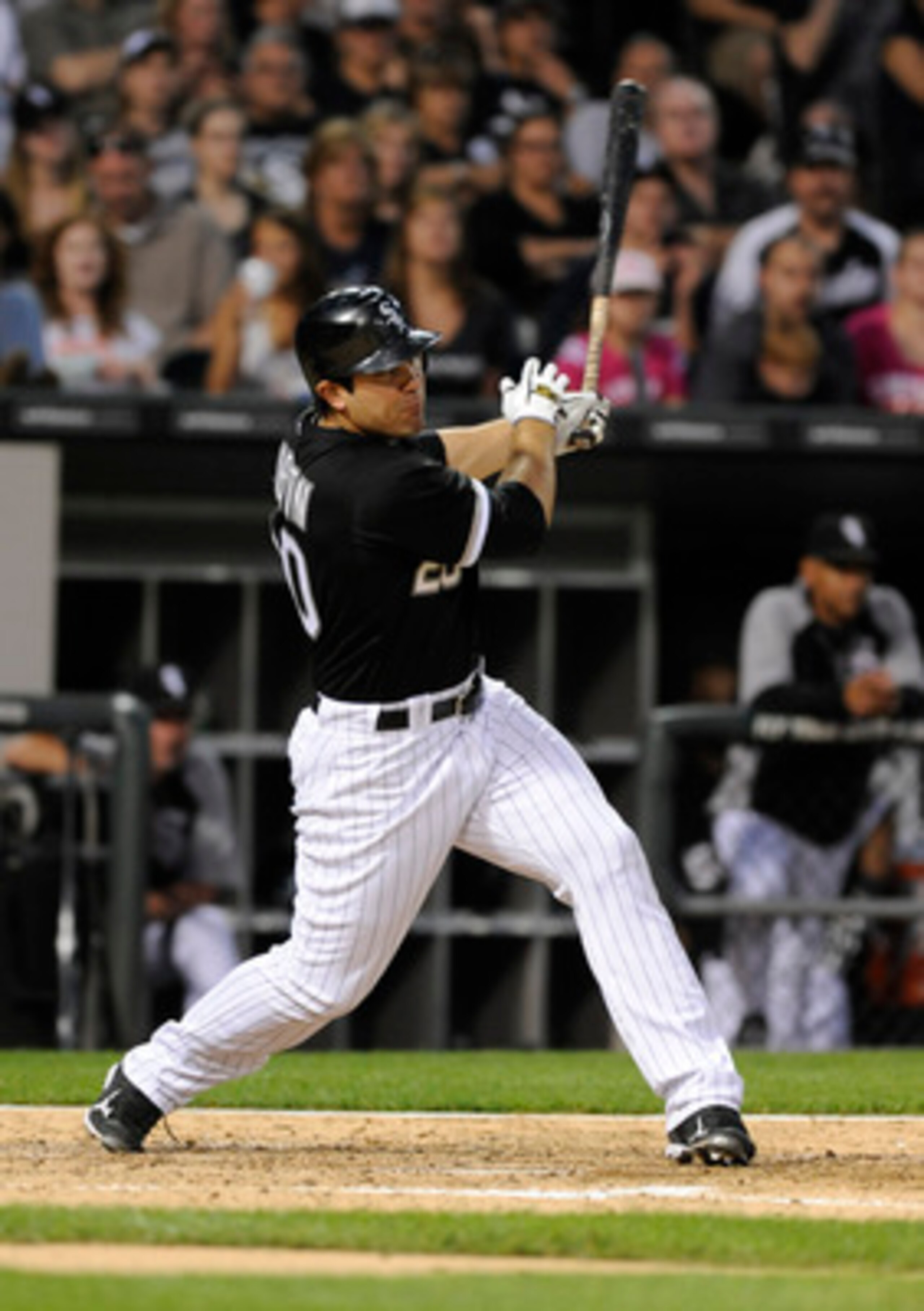 CHICAGO, IL - JUNE 03: Carlos Quentin #20 of the Chicago White Sox hits a three-run homer against the Detroit Tigers in the fourth inning on June 3, 2011 at U.S. Cellular Field in Chicago, Illinois.  (Photo by David Banks/Getty Images)