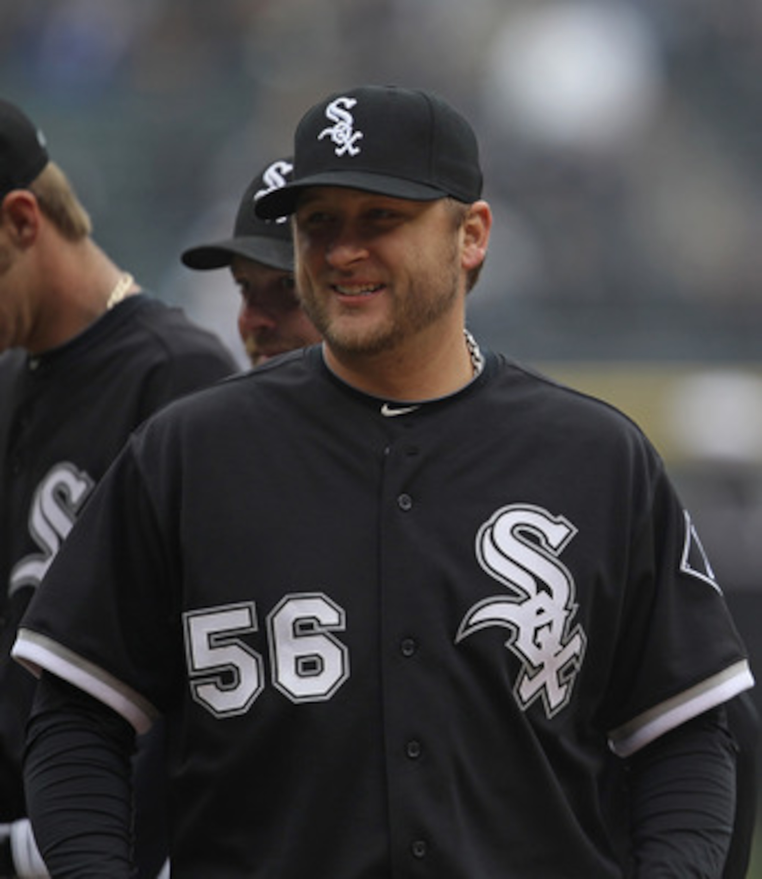 CHICAGO, IL - APRIL 07: Mark Buehrle #56 of the Chicago White Sox smiles at fans during player introductions before the home opener against the Tampa Bay Rays at U.S. Cellular Field on April 7, 2011 in Chicago, Illinois. The White Sox defeated the Rays 5-