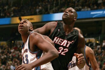 WAHINGTON - DECEMBER 15: Brendan Haywood #33 of the Washington Wizards and Shaquille O'Neal #32 of the Miami Heat battle for rebound position during the game on December 15, 2004 at the MCI Center in Washington D.C. The Heat won 98-93. NOTE TO USER: Us WAHINGTON - DECEMBER 15: Brendan Haywood #33 of the Washington Wizards and Shaquille O'Neal #32 of the Miami Heat battle for rebound position during the game on December 15, 2004 at the MCI Center in Washington D.C. The Heat won 98-93. NOTE TO USER: Us