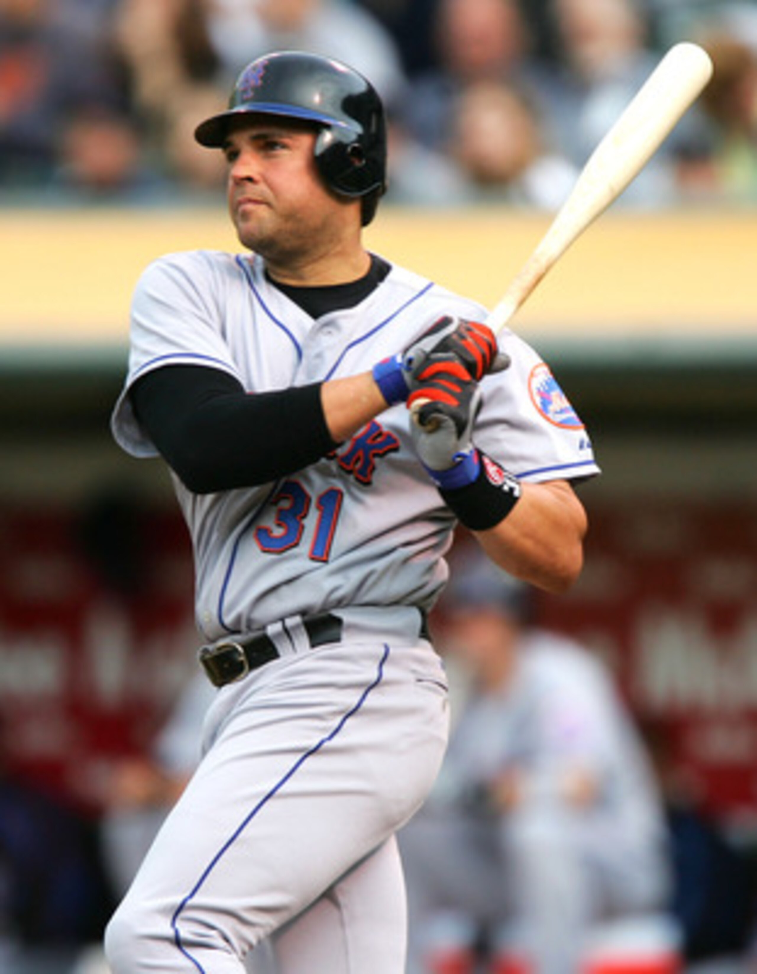OAKLAND, CA - JUNE 15:  Mike Piazza #31 of the New York Mets doubles against the Oakland Athletics in the second inning during an MLB game on June 15, 2005 at McAfee Coliseum in Oakland, California.  (Photo by Jed Jacobsohn/Getty Images)