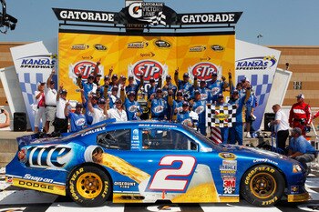 KANSAS CITY, KS - JUNE 05:  Brad Keselowski, driver of the #2 Miller Lite Dodge, celebrates in Victory Lane after winning the NASCAR Sprint Cup Series STP 400 at Kansas Speedway on June 5, 2011 in Kansas City, Kansas.  (Photo by Geoff Burke/Getty Images f