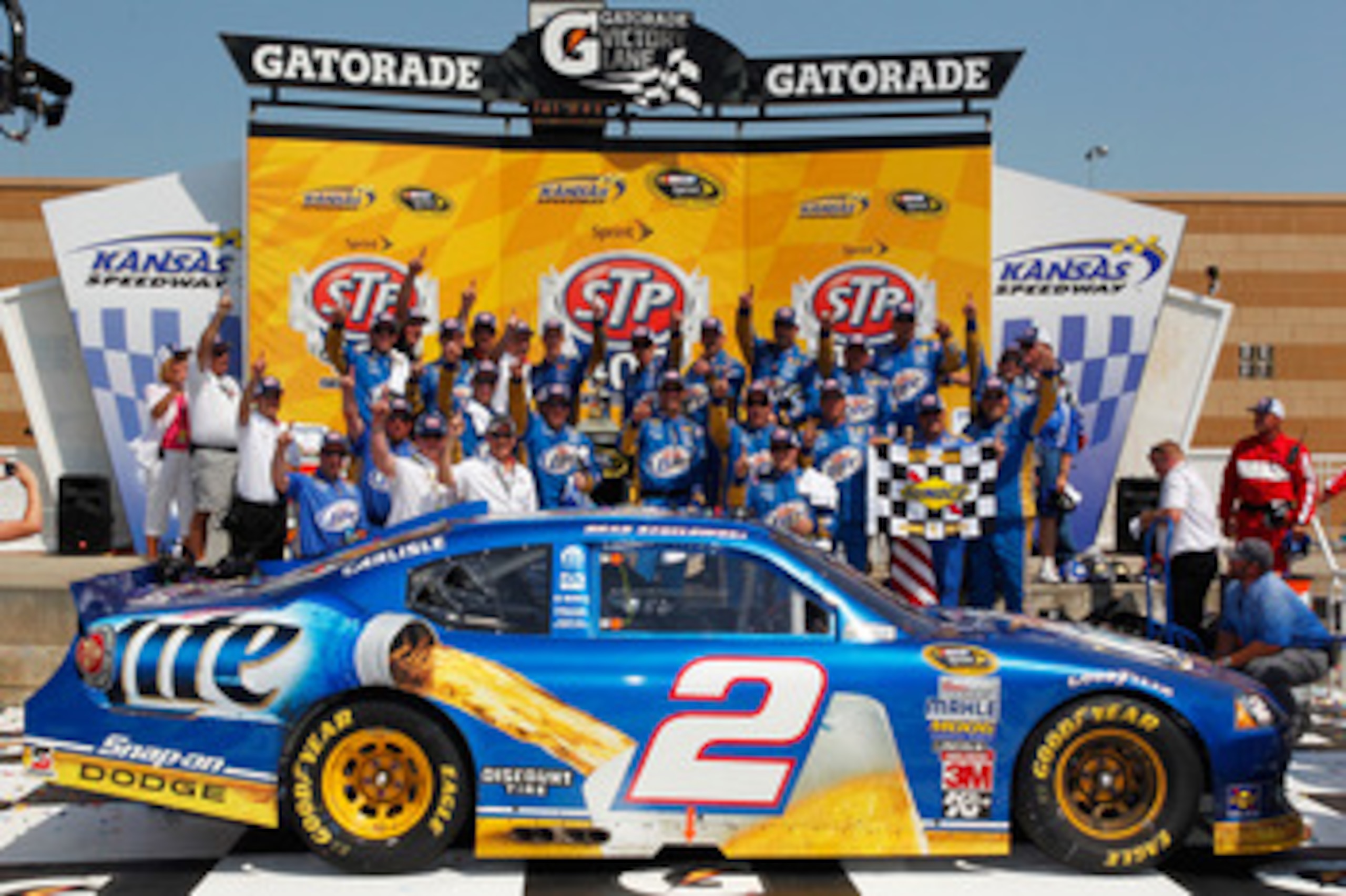 KANSAS CITY, KS - JUNE 05:  Brad Keselowski, driver of the #2 Miller Lite Dodge, celebrates in Victory Lane after winning the NASCAR Sprint Cup Series STP 400 at Kansas Speedway on June 5, 2011 in Kansas City, Kansas.  (Photo by Geoff Burke/Getty Images f