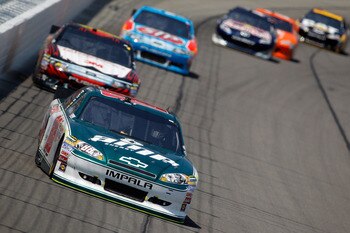KANSAS CITY, KS - JUNE 05:  Dale Earnhardt Jr., driver of the #88 Amp Energy/National Guard Chevrolet, leads a group of cars during the NASCAR Sprint Cup Series STP 400 at Kansas Speedway on June 5, 2011 in Kansas City, Kansas.  (Photo by Todd Warshaw/Get