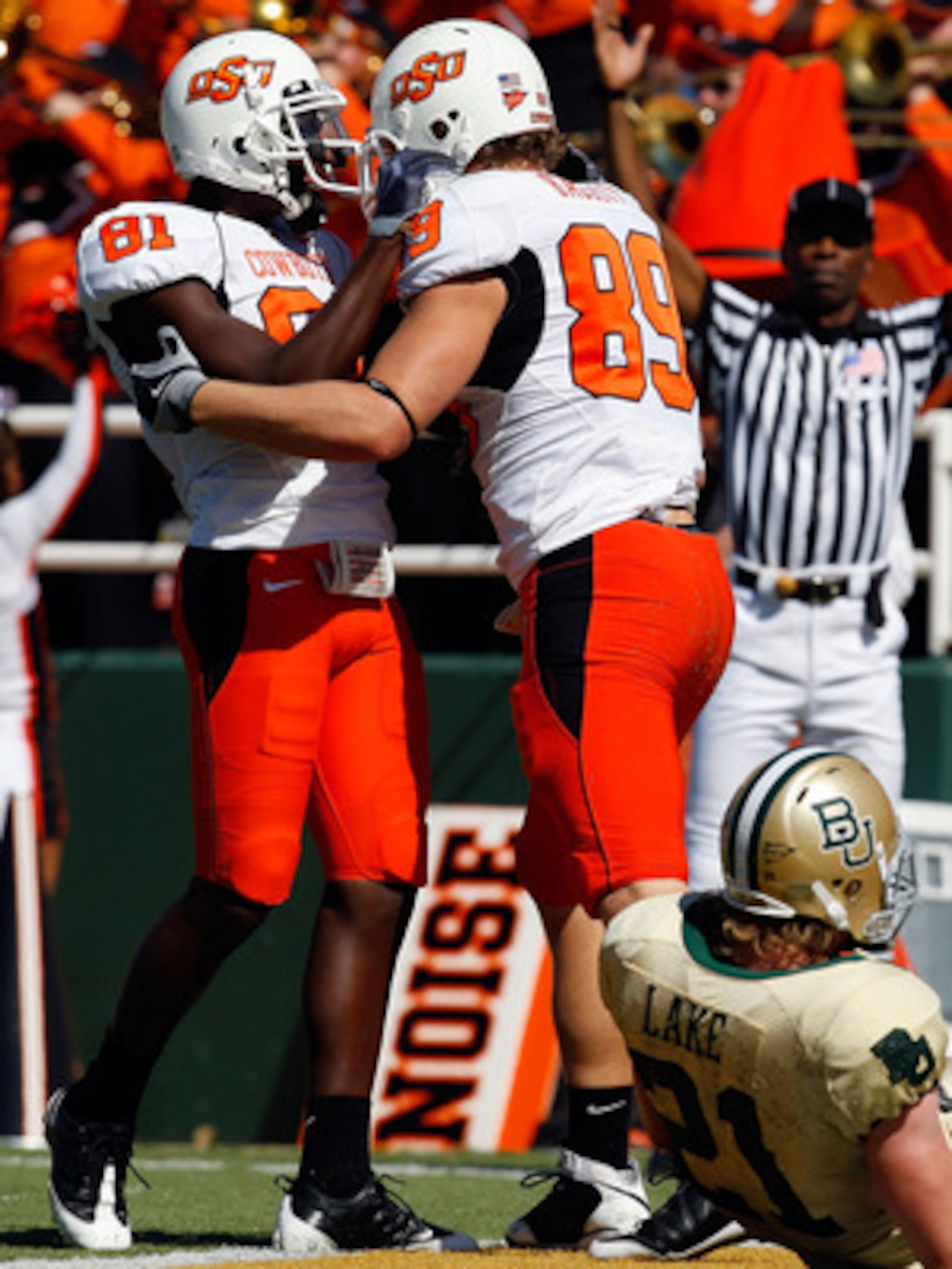 WACO, TX - OCTOBER 24:  Justin Blackmon #81 and Cooper Nicholas #89 of the Oklahoma State Cowboys celebrate a touchdown in front of Jordan Lake #21 of the Baylor Bears at Floyd Casey Stadium on October 24, 2009 in Waco, Texas.  (Photo by Ronald Martinez/G