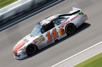 KANSAS CITY, KS - JUNE 05:  Tony Stewart, driver of the #14 The Glades/Office Depot Chevrolet, races during the NASCAR Sprint Cup Series STP 400 at Kansas Speedway on June 5, 2011 in Kansas City, Kansas.  (Photo by Geoff Burke/Getty Images for NASCAR)