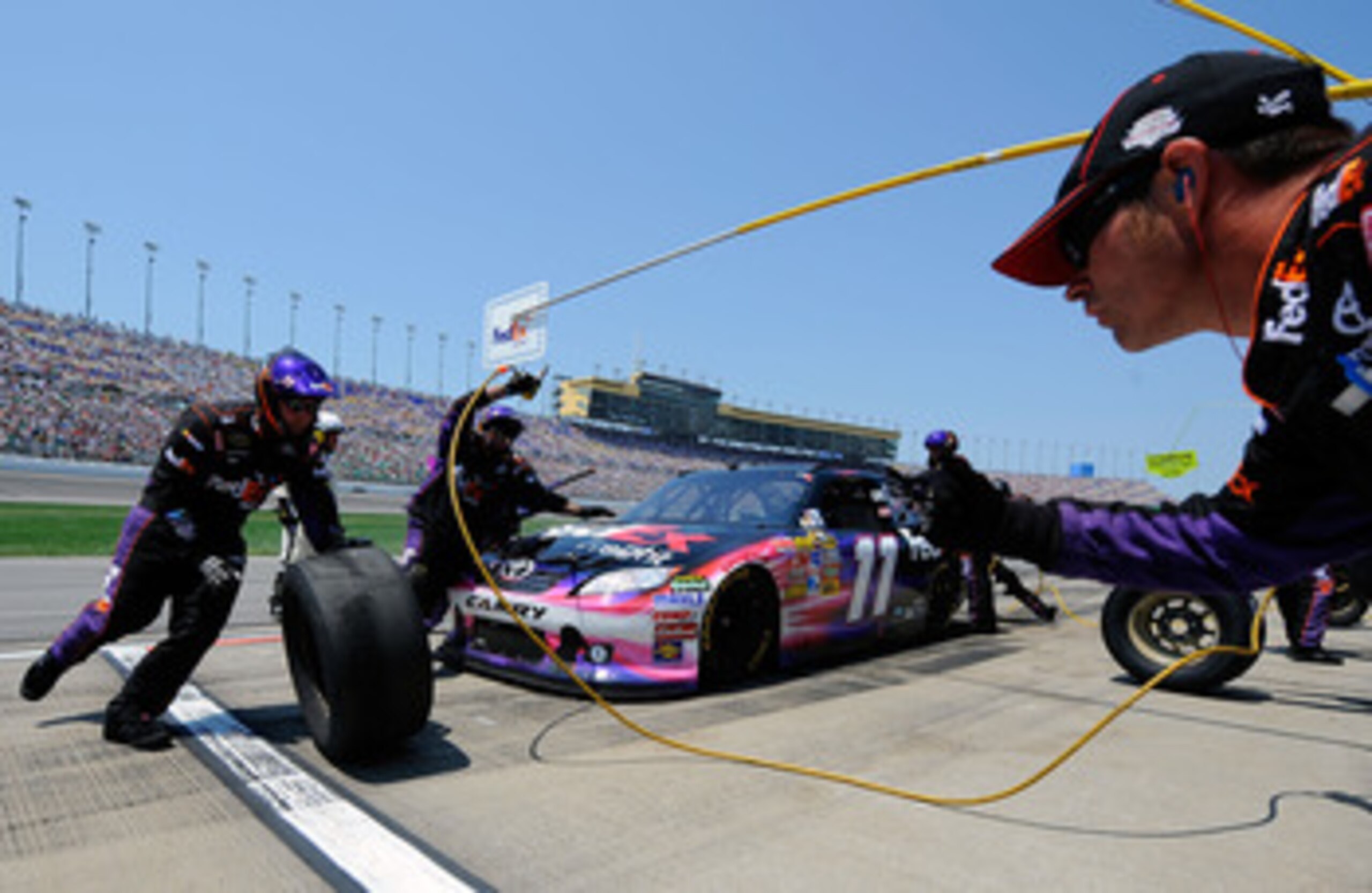 KANSAS CITY, KS - JUNE 05:  Denny Hamlin pits the #11 FedEx Freight Toyota during the NASCAR Sprint Cup Series STP 400 at Kansas Speedway on June 5, 2011 in Kansas City, Kansas.  (Photo by Jared C. Tilton/Getty Images for NASCAR)