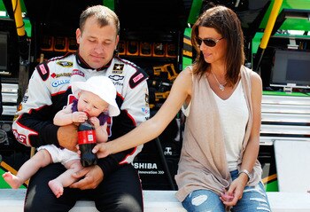 KANSAS CITY, KS - JUNE 05:  Ryan Newman, driver of the #39 Haas Automation Chevrolet, his wife Krissie Newman and their daughter Brooklyn Sage Newman sits together prior to the NASCAR Sprint Cup Series STP 400 at Kansas Speedway on June 5, 2011 in Kansas 