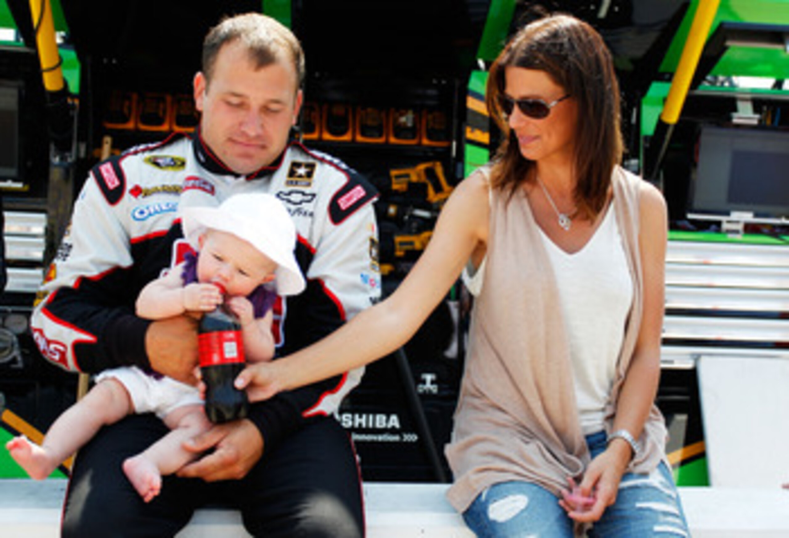KANSAS CITY, KS - JUNE 05:  Ryan Newman, driver of the #39 Haas Automation Chevrolet, his wife Krissie Newman and their daughter Brooklyn Sage Newman sits together prior to the NASCAR Sprint Cup Series STP 400 at Kansas Speedway on June 5, 2011 in Kansas 