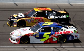 KANSAS CITY, KS - JUNE 05:  Mark Martin, driver of the #5 Farmers Insurance/GoDaddy.com Chevrolet, races Jeff Burton, driver of the #31 Caterpillar Chevrolet, during the NASCAR Sprint Cup Series STP 400 at Kansas Speedway on June 5, 2011 in Kansas City, K