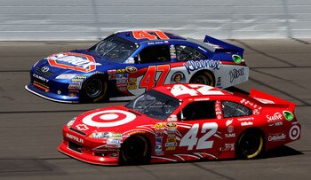 KANSAS CITY, KS - JUNE 05:  Juan Pablo Montoya, driver of the #42 Target Chevrolet, races Bobby Labonte, driver of the #47 Clorox/Kleenex Toyota, during the NASCAR Sprint Cup Series STP 400 at Kansas Speedway on June 5, 2011 in Kansas City, Kansas.  (Phot