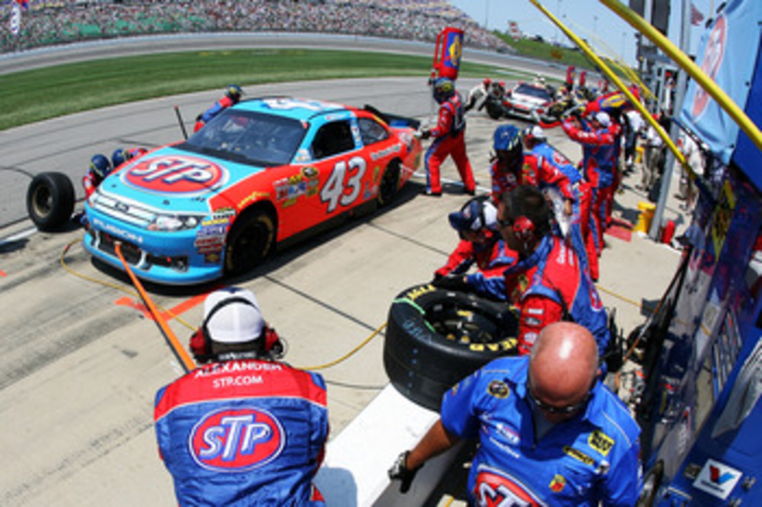 KANSAS CITY, KS - JUNE 05:  A.J. Allmendinger pits the #43 STP Ford during the NASCAR Sprint Cup Series STP 400 at Kansas Speedway on June 5, 2011 in Kansas City, Kansas.  (Photo by Tim Umphrey/Getty Images for NASCAR)