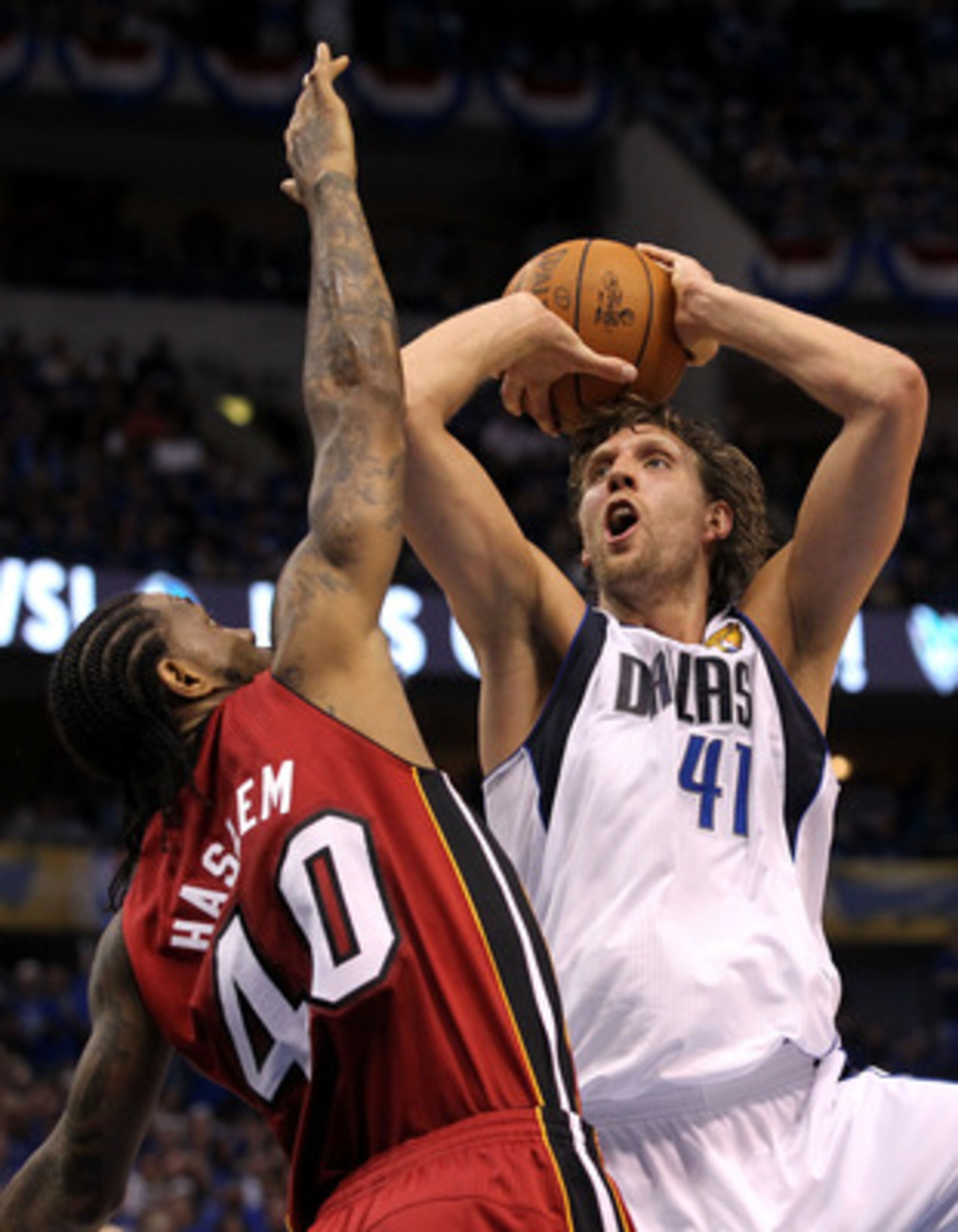 DALLAS, TX - JUNE 05:  Dirk Nowitzki #41 of the Dallas Mavericks attempts a shot against Udonis Haslem #40 of the Miami Heat in Game Three of the 2011 NBA Finals at American Airlines Center on June 5, 2011 in Dallas, Texas.  NOTE TO USER: User expressly a