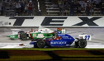 FORT WORTH, TX - JUNE 12: Tony Kanaan driver of the #11 Team 7-Eleven Andretti Green Racing Honda Dallara celebrates with his teamate Dario Franchitti driver of the #27 ArcaEx Andretti Green Racing Honda Dallara after they finished first and second during