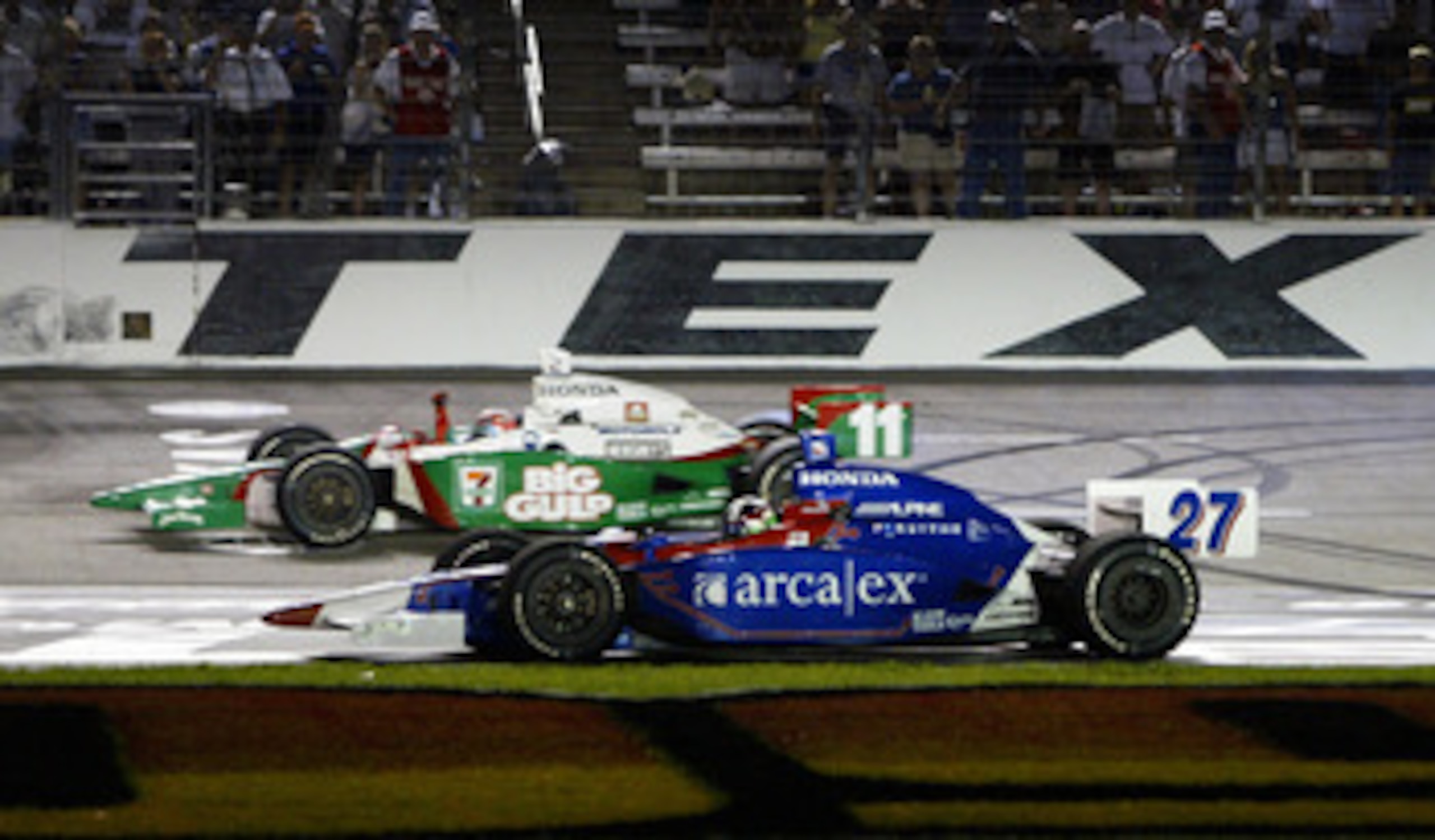 FORT WORTH, TX - JUNE 12: Tony Kanaan driver of the #11 Team 7-Eleven Andretti Green Racing Honda Dallara celebrates with his teamate Dario Franchitti driver of the #27 ArcaEx Andretti Green Racing Honda Dallara after they finished first and second during FORT WORTH, TX - JUNE 12: Tony Kanaan driver of the #11 Team 7-Eleven Andretti Green Racing Honda Dallara celebrates with his teamate Dario Franchitti driver of the #27 ArcaEx Andretti Green Racing Honda Dallara after they finished first and second during