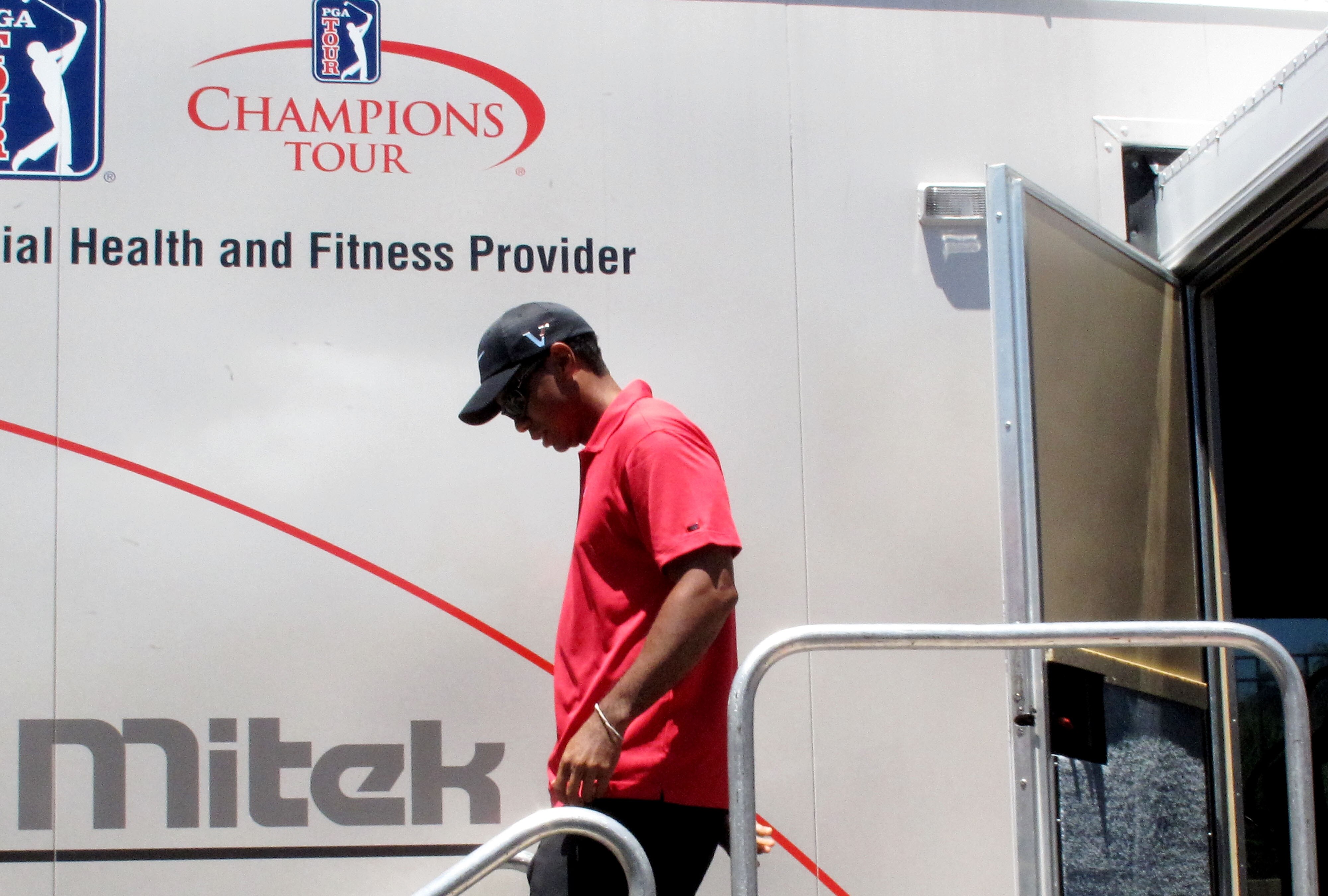 PONTE VEDRA BEACH, FL - MAY 09:  Tiger Woods walks out of the player fitness truck after withdrawing from the tournament on the seventh hole with a neck injury during the final round of THE PLAYERS Championship held at THE PLAYERS Stadium course at TPC Sa