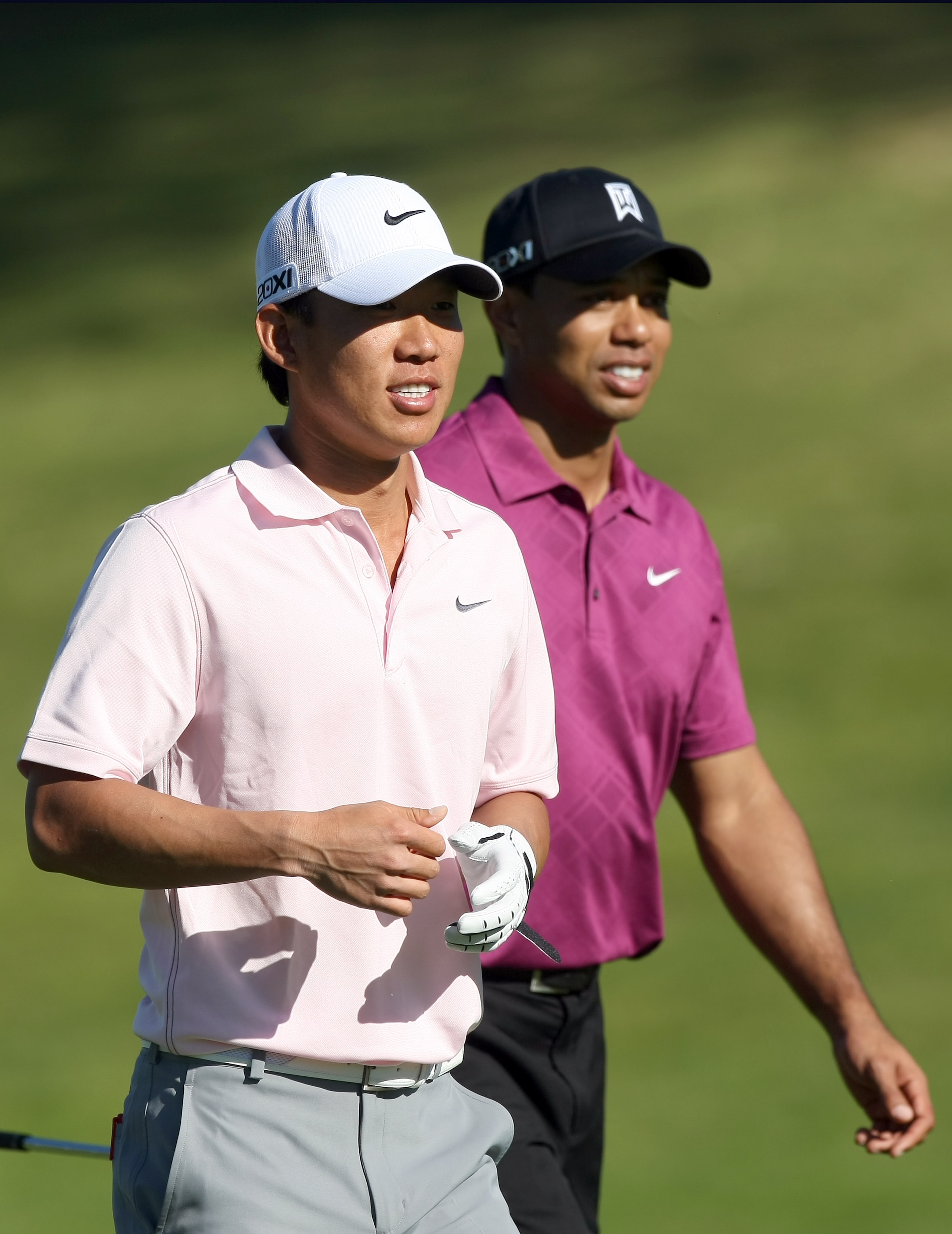 LA JOLLA, CA - JANUARY 27:  Anthony Kim walks the fariway with Tiger Woods during the first round of the Farmers Insurance Open at Torrey Pines on January 27, 2011 in La Jolla, California. (Photo by Donald Miralle/Getty Images)