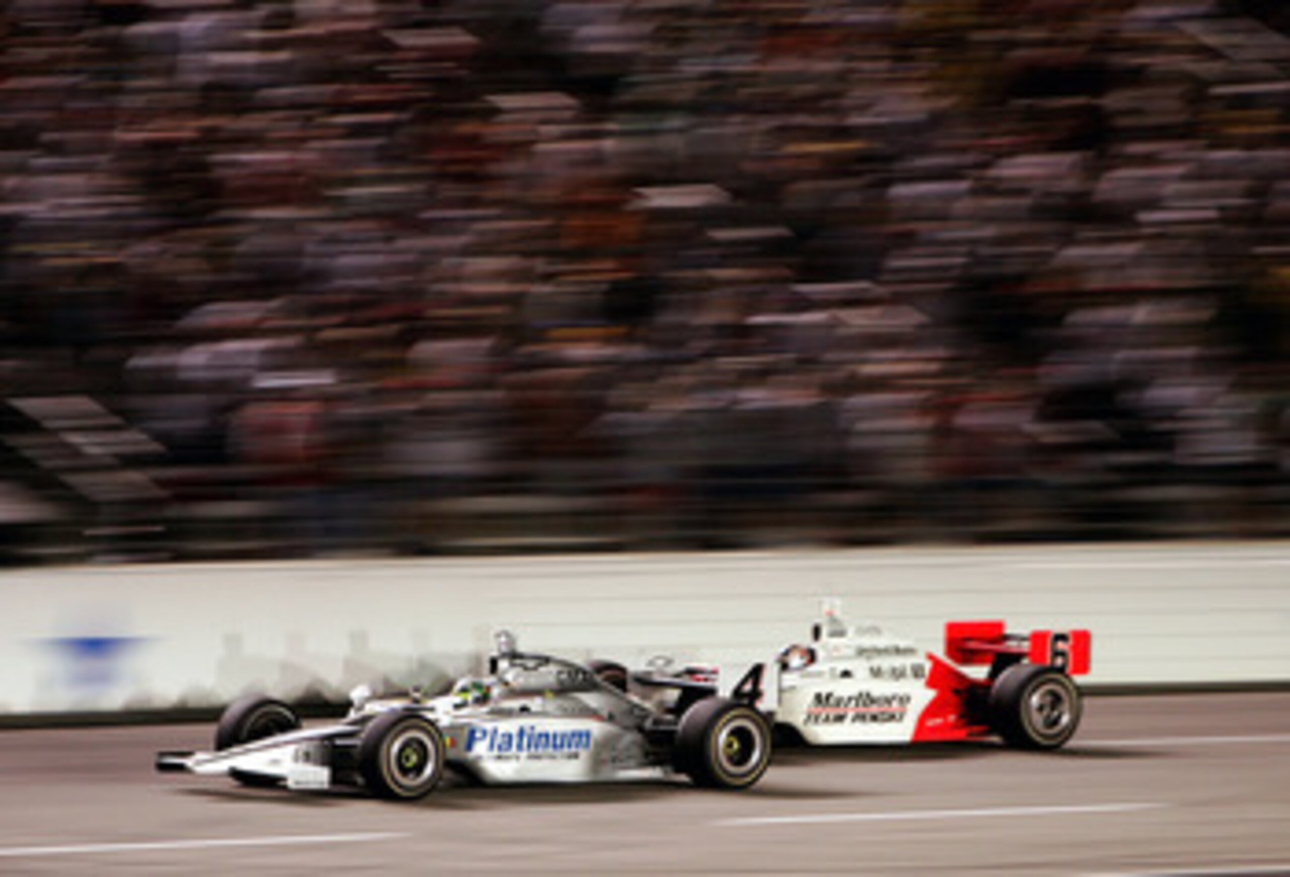 FORT WORTH, TX - JUNE 11: Tomas Scheckter, driver of the #4 Panther Racing Pennzoil Dallara Chevrolet, beats Sam Hornish Jr., driver of the #6 Marlboro Team Penske Dallara Toyota, to the finish line to win the IRL IndyCar Series Bombardier Learjet 500 on FORT WORTH, TX - JUNE 11: Tomas Scheckter, driver of the #4 Panther Racing Pennzoil Dallara Chevrolet, beats Sam Hornish Jr., driver of the #6 Marlboro Team Penske Dallara Toyota, to the finish line to win the IRL IndyCar Series Bombardier Learjet 500 on