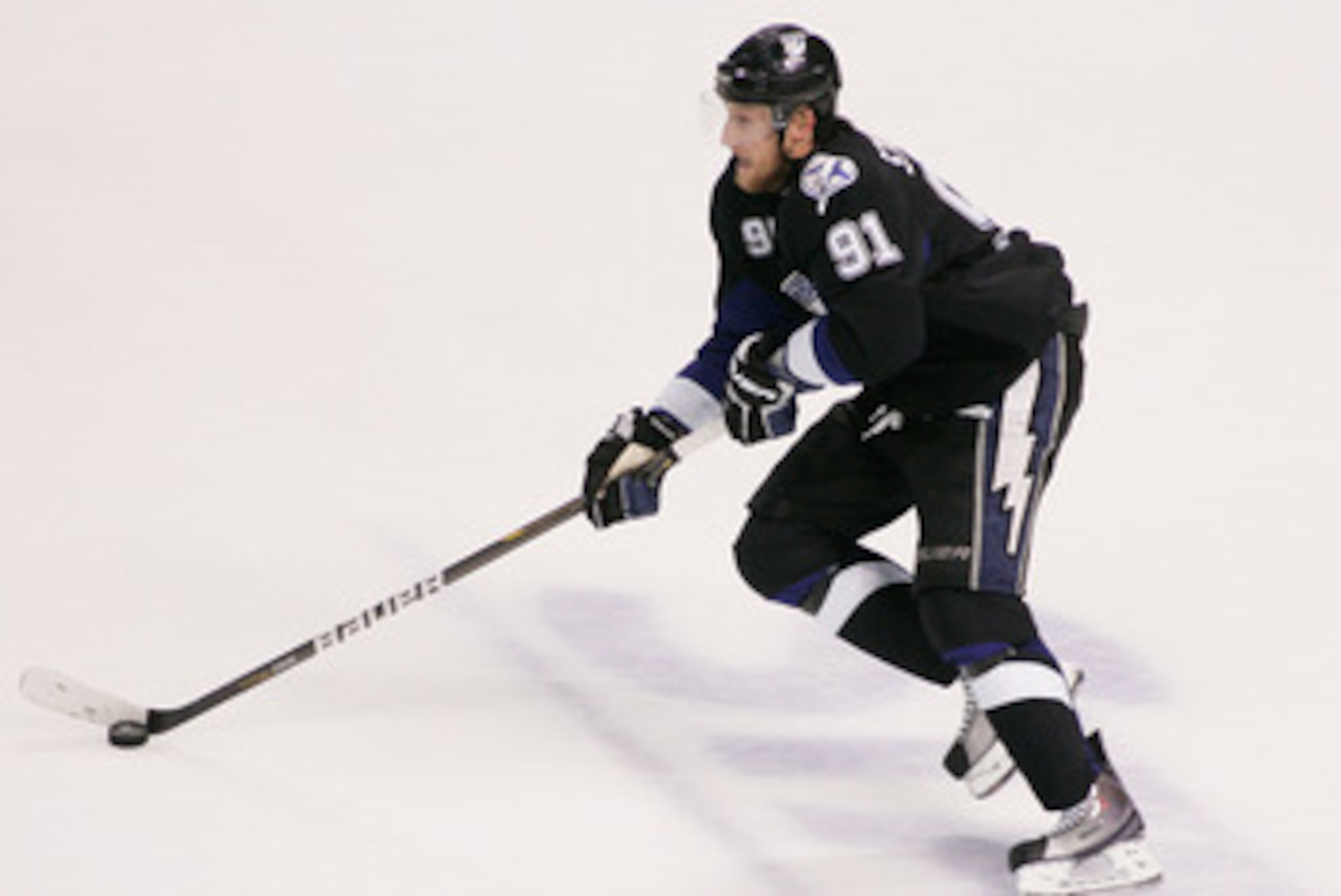 TAMPA, FL - MAY 25:  Steven Stamkos #91 of the Tampa Bay Lightning controls the puck in Game Six of the Eastern Conference Finals against the Boston Bruins during the 2011 NHL Stanley Cup Playoffs at St Pete Times Forum on May 25, 2011 in Tampa, Florida. 