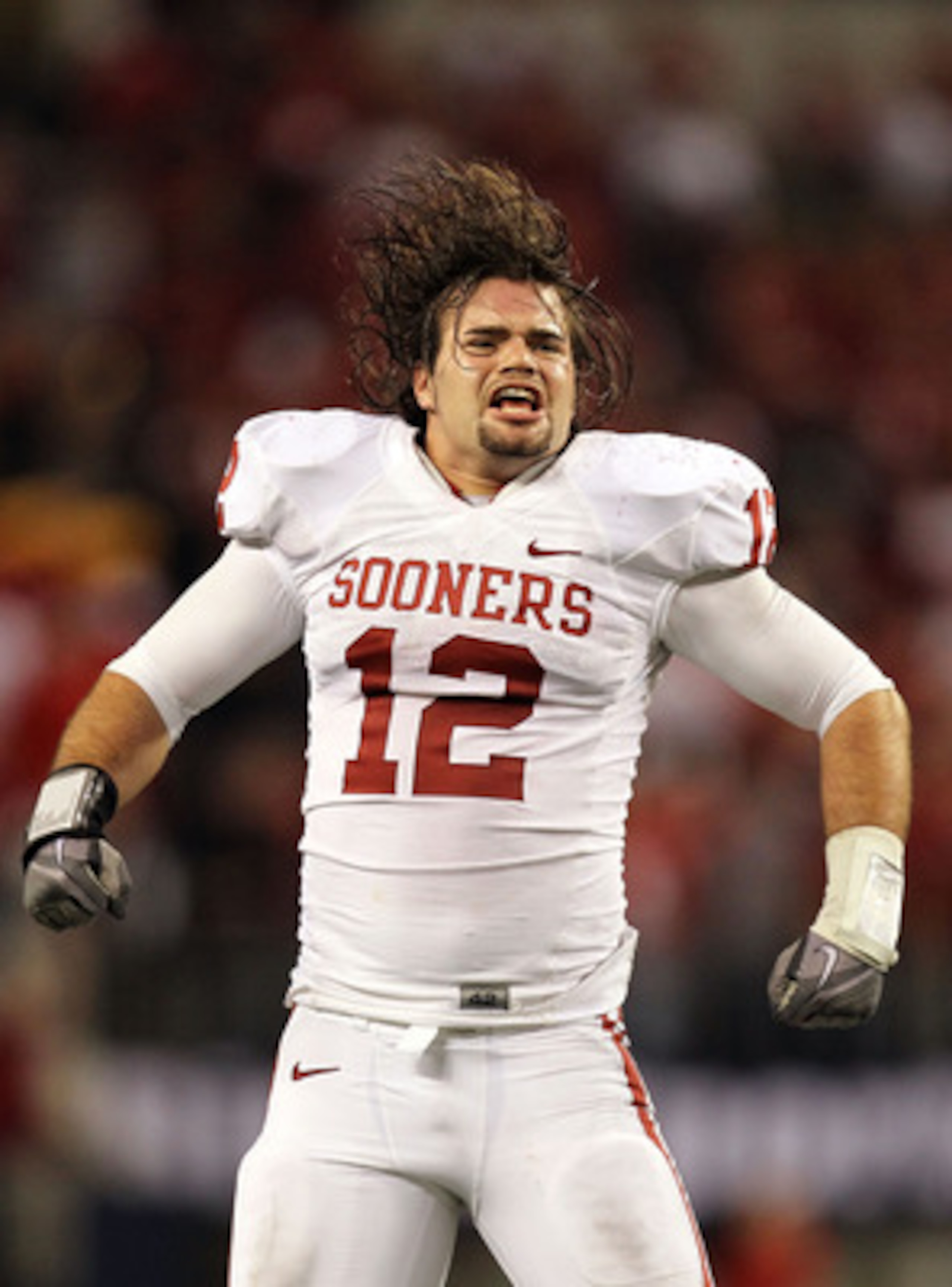 ARLINGTON, TX - DECEMBER 04:  Linebacker Austin Box #12 of the Oklahoma Sooners celebrates a 23-20 win against the Nebraska Cornhuskers during the Big 12 Championship at Cowboys Stadium on December 4, 2010 in Arlington, Texas.  (Photo by Ronald Martinez/G