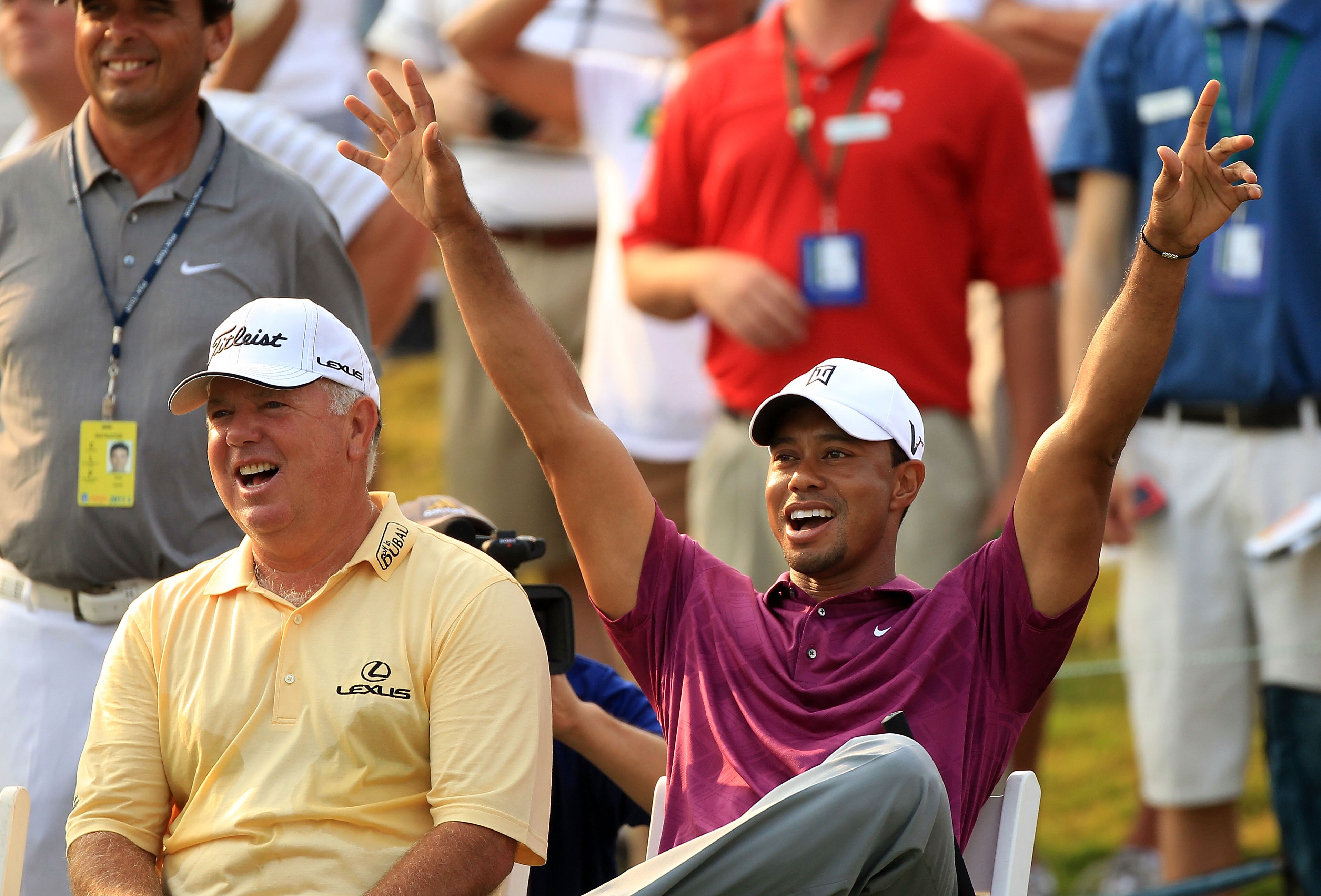 PONTE VEDRA BEACH, FL - MAY 11:  Tiger Woods (R) and Mark O'Meara (L) react to a shot by caddie Steve Williams (not pictured) for the 'Caddie Challenge' on the 17th hole during a practice round prior to the start of THE PLAYERS Championship held at THE PL